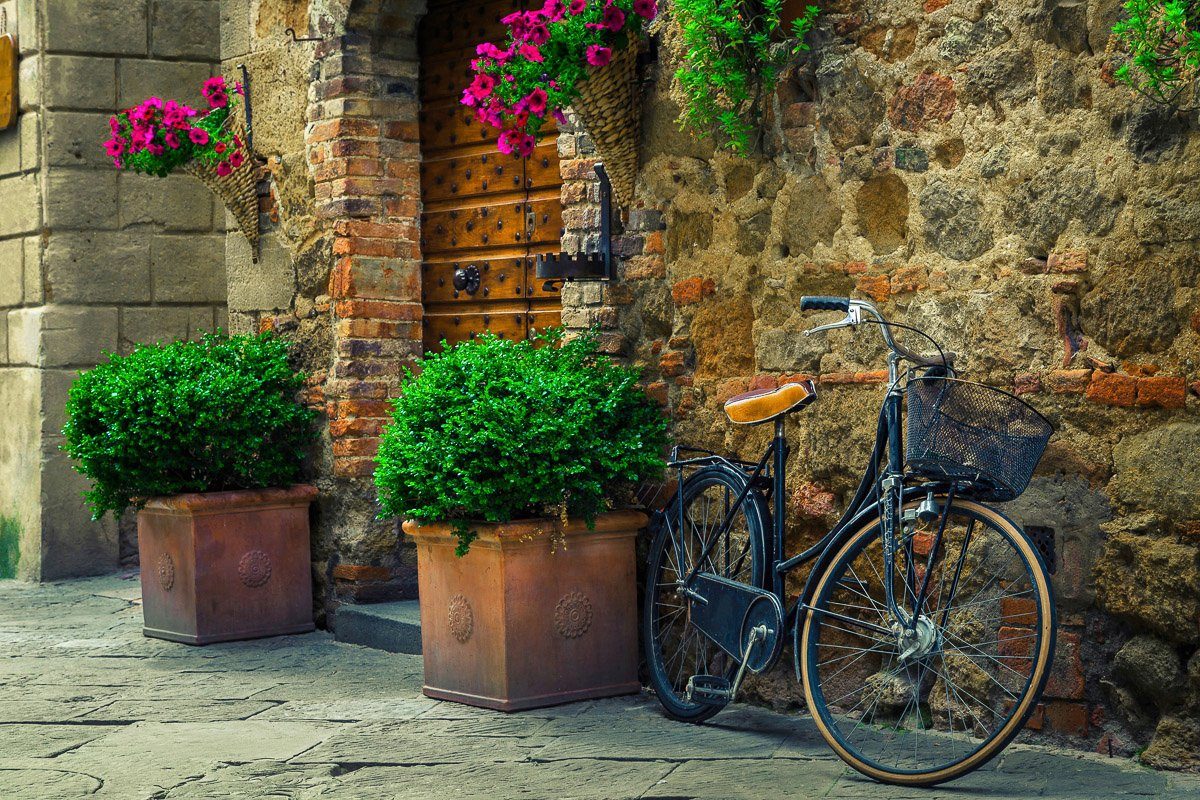Papermoon Fototapete Fahrrad vor Steinmauer