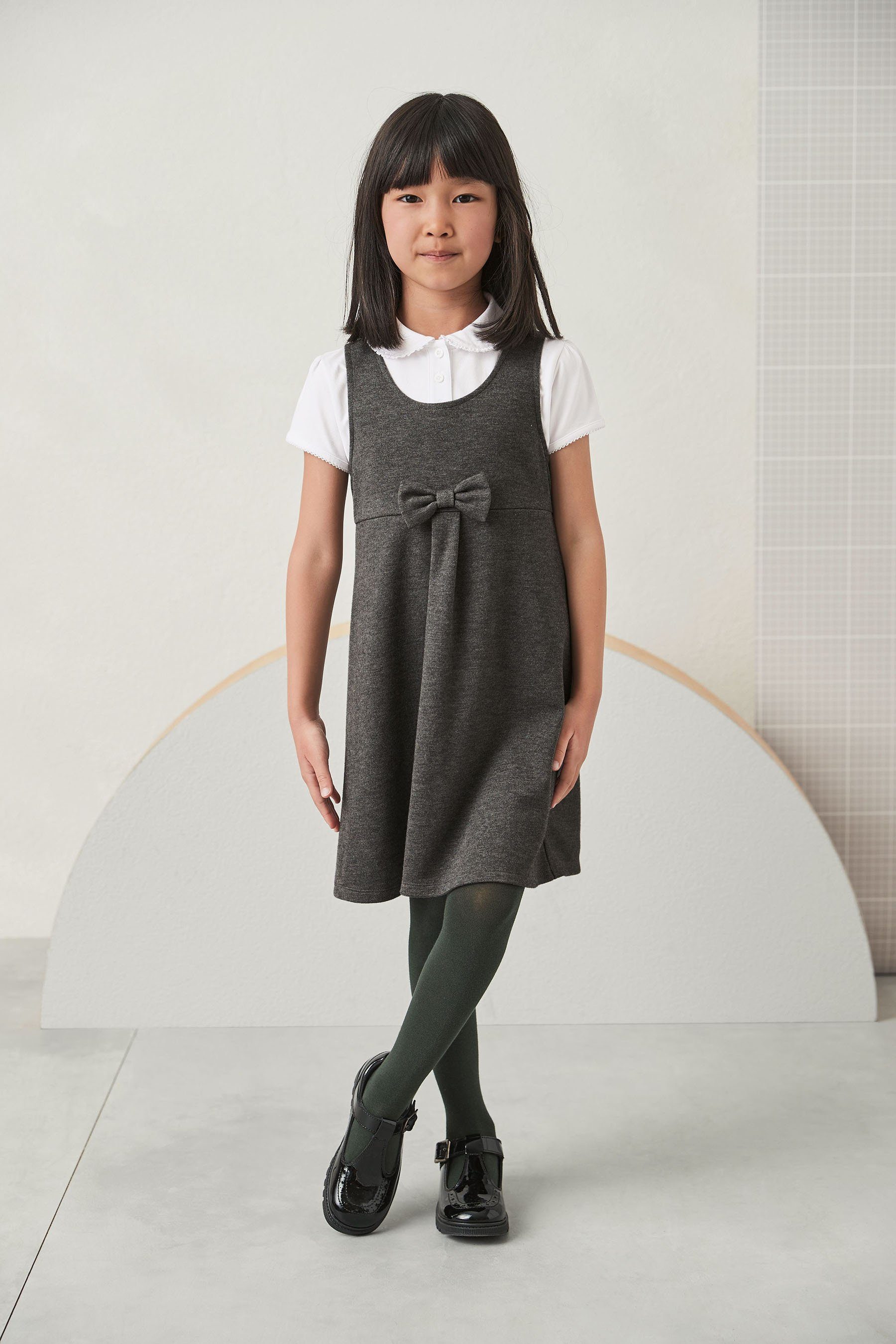 Next Latzkleid Schul-Latzkleid mit Grey Jersey aus (1-tlg) Zierschleife