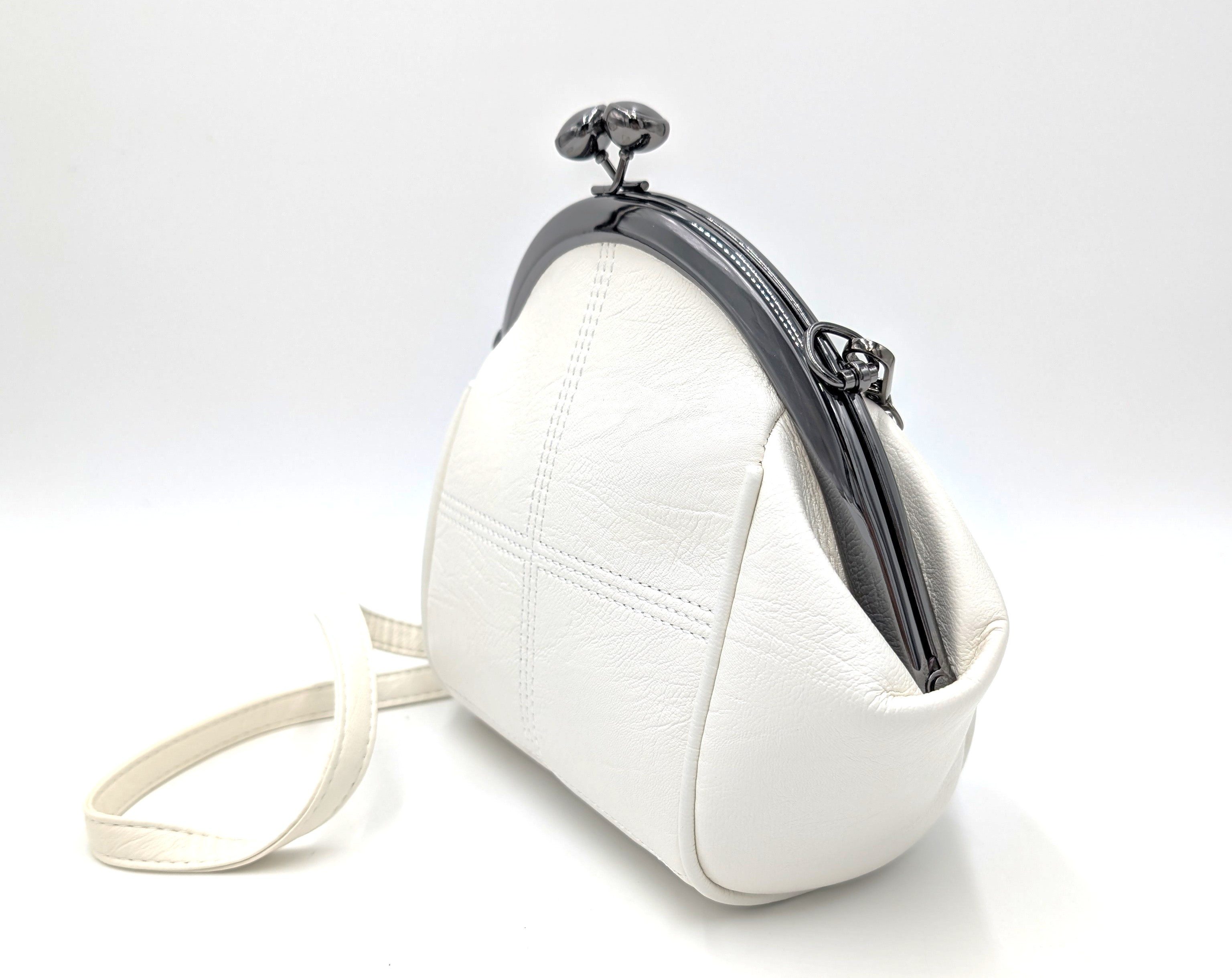 Mera Vellon Handtasche Damen Schultertasche "Varela" Umhängetasche mit Clipverschluss, Veganes Leder mit praktischem Clipverschluss