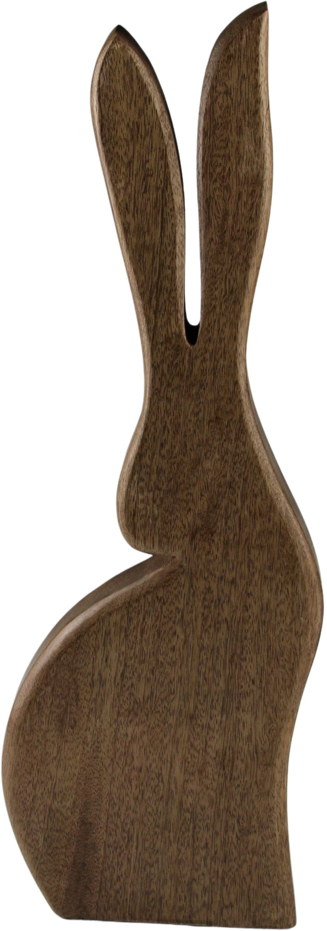 Holz, ein Dekofigur, (1 aus AM Zaubert Frühjahrsdeko, ins Ostern, Lächeln Design jedem Betrachter Gesicht St), Osterdekoration Osterhase Osterfigur