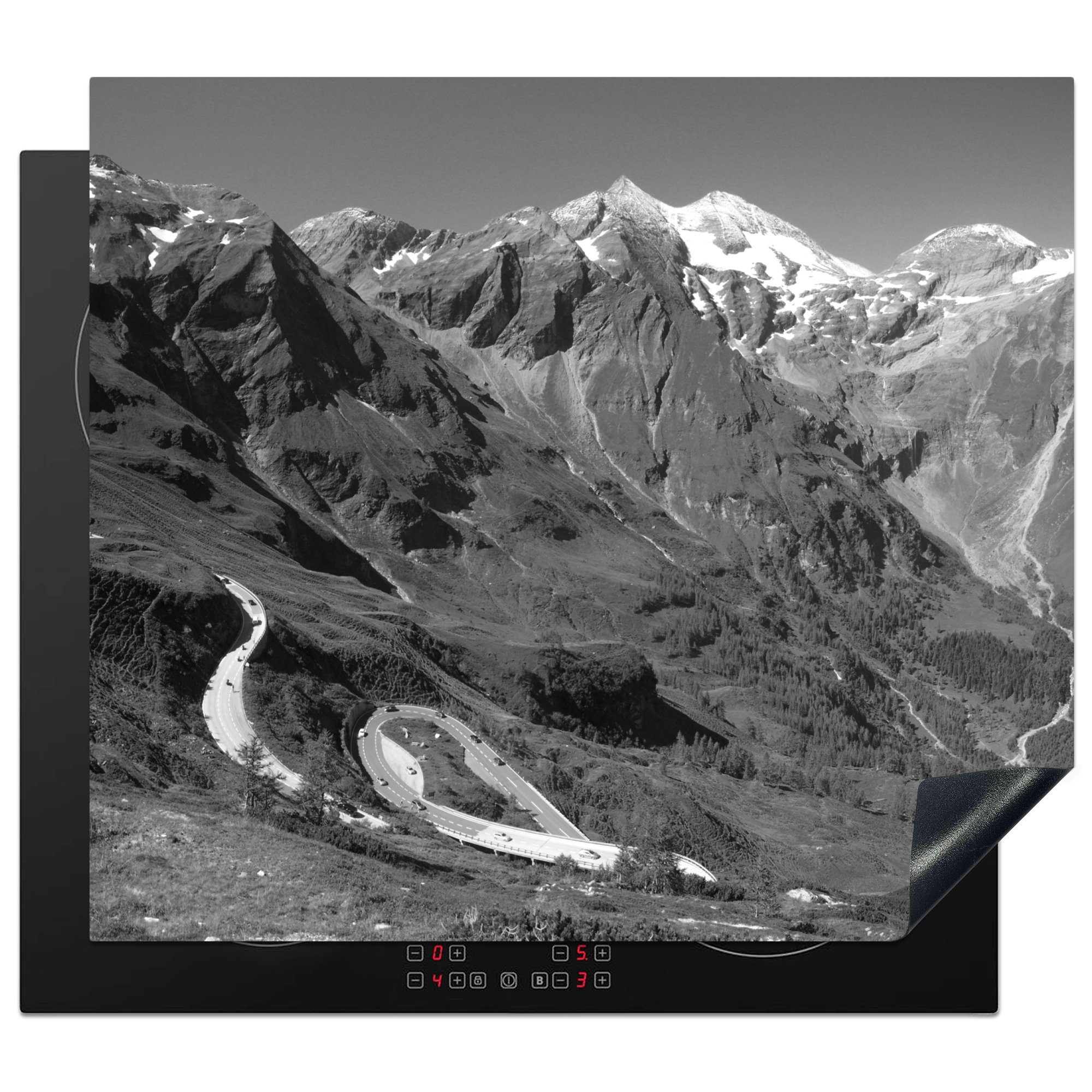 MuchoWow Herdblende-/Abdeckplatte Die Großglocknerstraße durch die österreichischen Alpen - schwarz und, Vinyl, (1 tlg), 60x52 cm, Mobile Arbeitsfläche nutzbar, Ceranfeldabdeckung