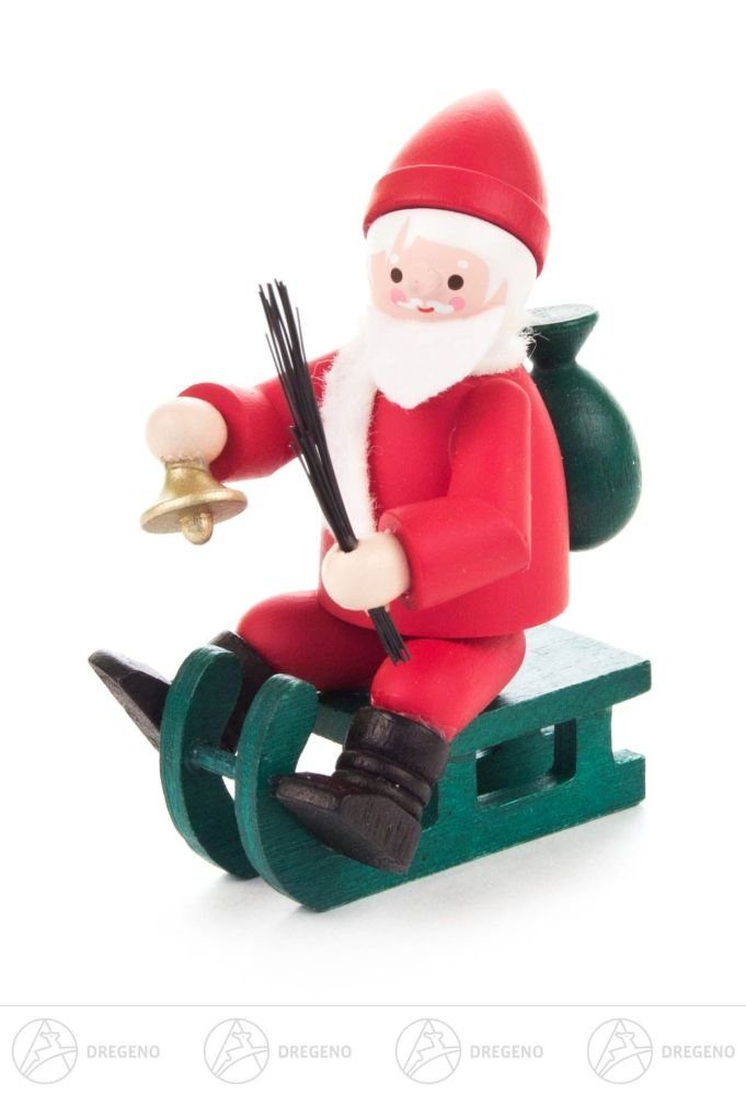 Dregeno Erzgebirge Weihnachtsfigur Weihnachtliche Miniatur Nikolaus auf Schlitten farbig Höhe ca 6 cm N, auf Schlitten mit Glocke Rute und Geschenkesack