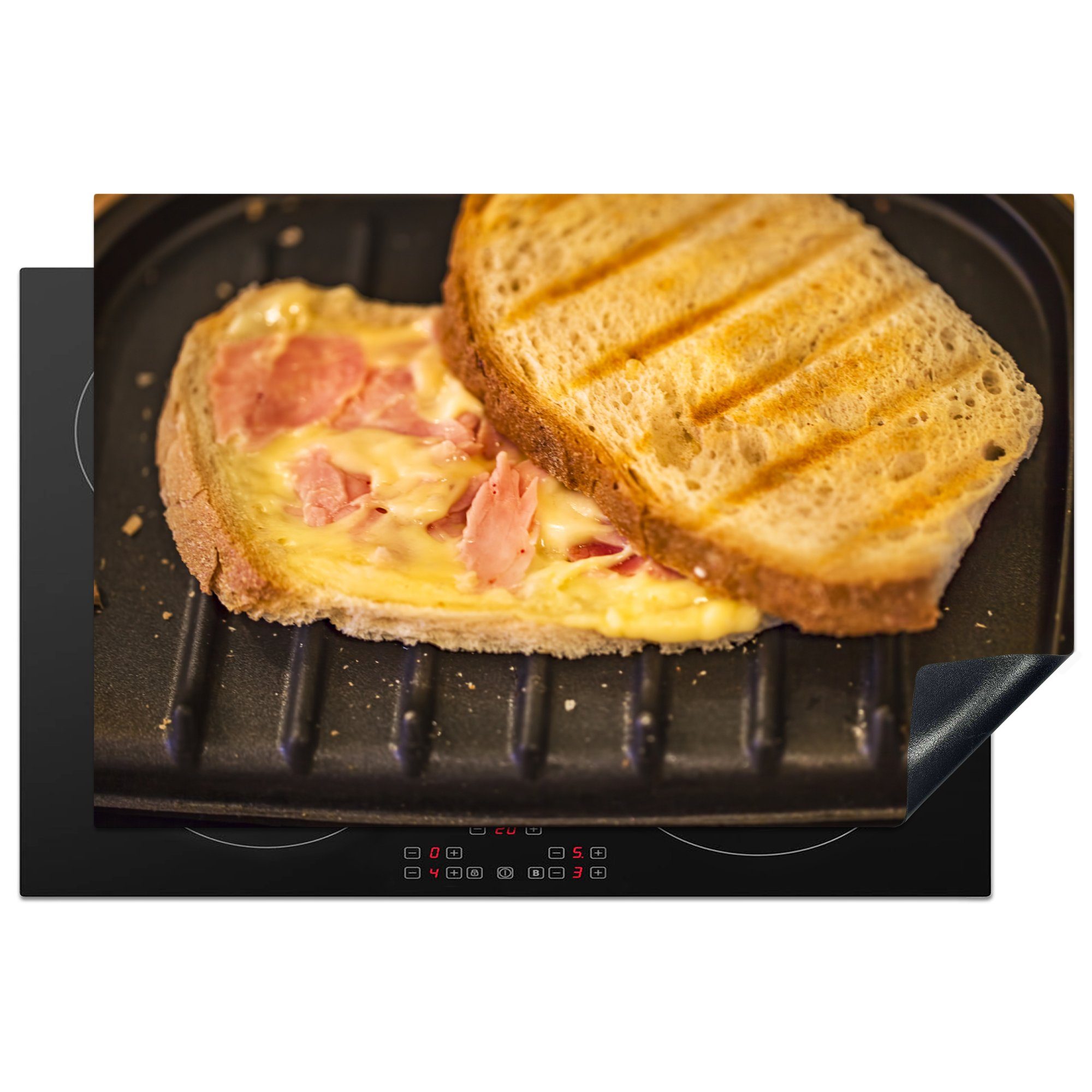 MuchoWow Herdblende-/Abdeckplatte Schinken-Käse-Toast auf einem Toaster, Vinyl, (1 tlg), 81x52 cm, Induktionskochfeld Schutz für die küche, Ceranfeldabdeckung