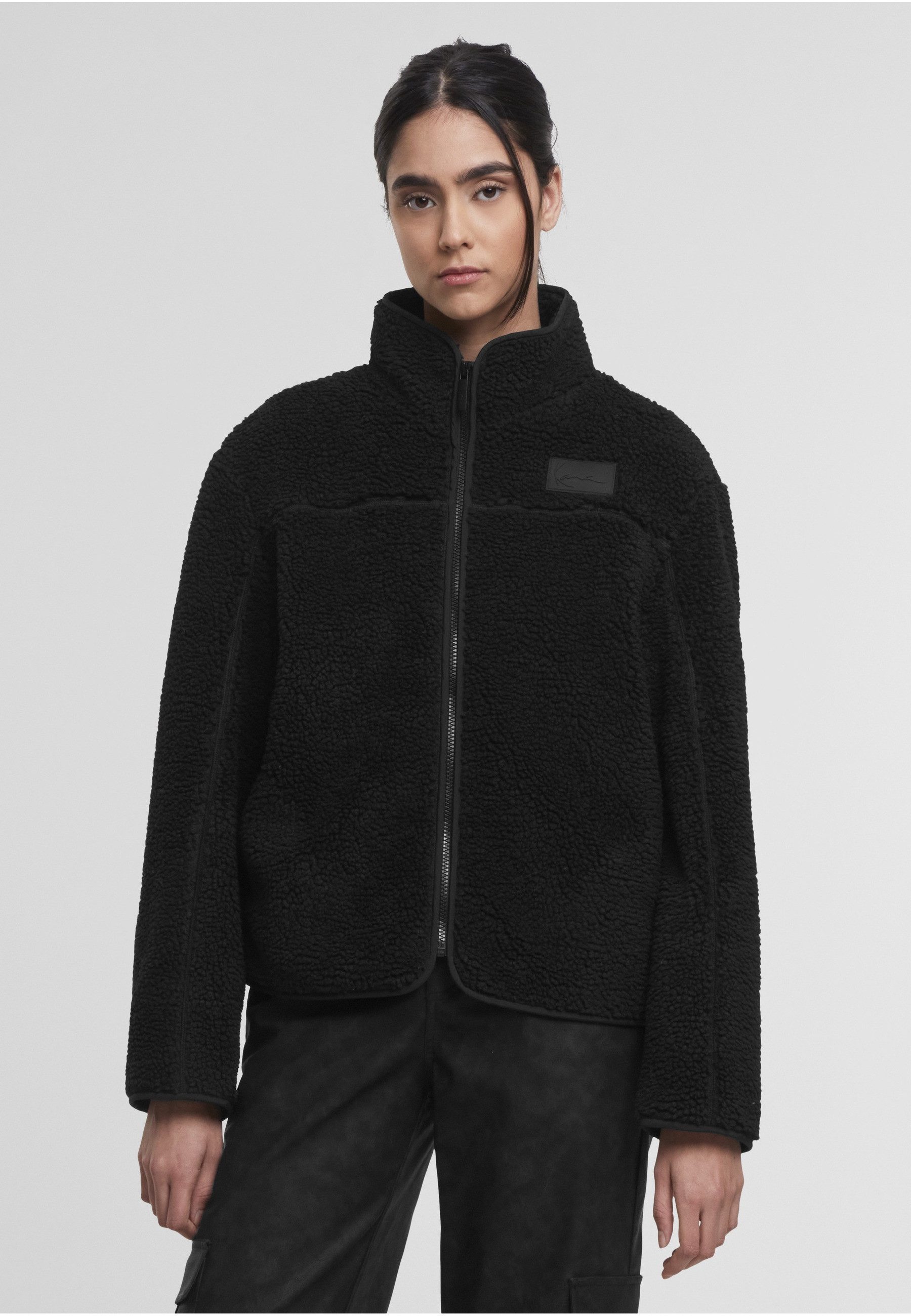 Karl Kani Trainingsjacke Karl Kani Signature Teddy Trackjacket (1-St)