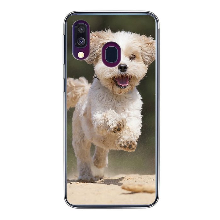 MuchoWow Handyhülle Ein Shih Tzu Hund hüpft durch den gelben Sand Handyhülle Samsung Galaxy A40 Smartphone-Bumper Print Handy