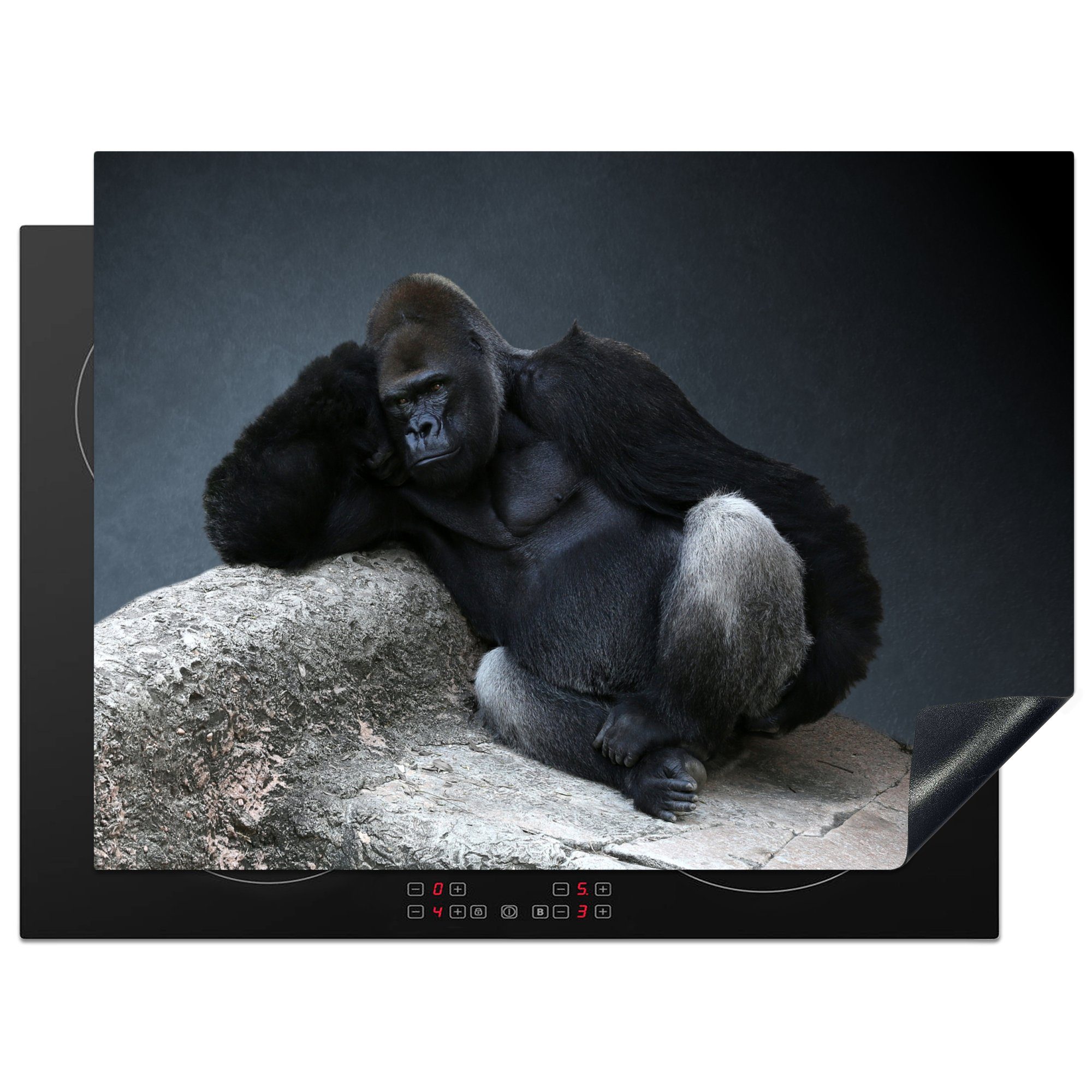 MuchoWow Herdblende-/Abdeckplatte Gorilla entspannt auf einem Felsen, Vinyl, (1 tlg), 71x52 cm, Induktionskochfeld Schutz für die küche, Ceranfeldabdeckung