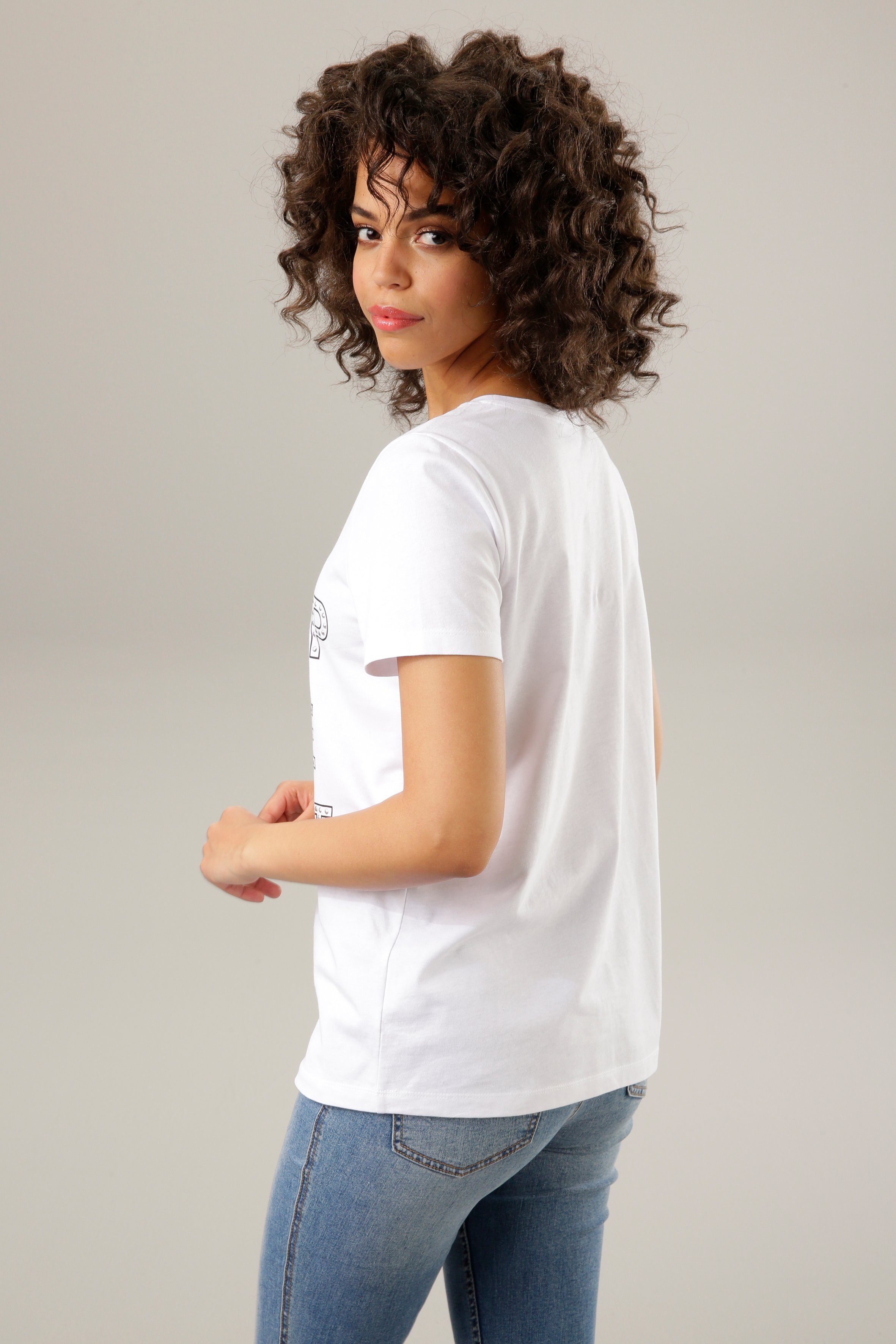 Print-Shirt mit Schriftzug bunten Glitzerstreifen, Nieten Aniston und CASUAL