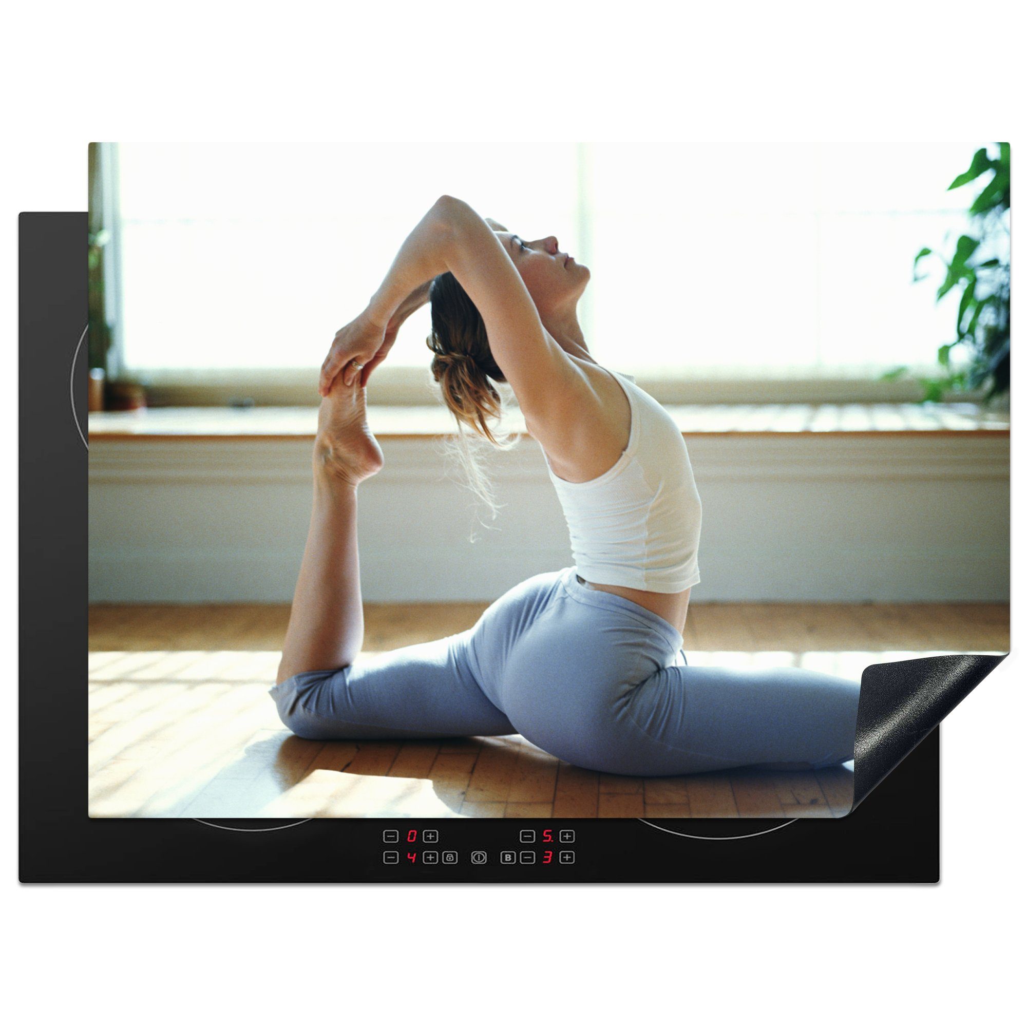 MuchoWow Herdblende-/Abdeckplatte Eine Frau praktiziert Yoga, Vinyl, (1 tlg), 70x52 cm, Mobile Arbeitsfläche nutzbar, Ceranfeldabdeckung