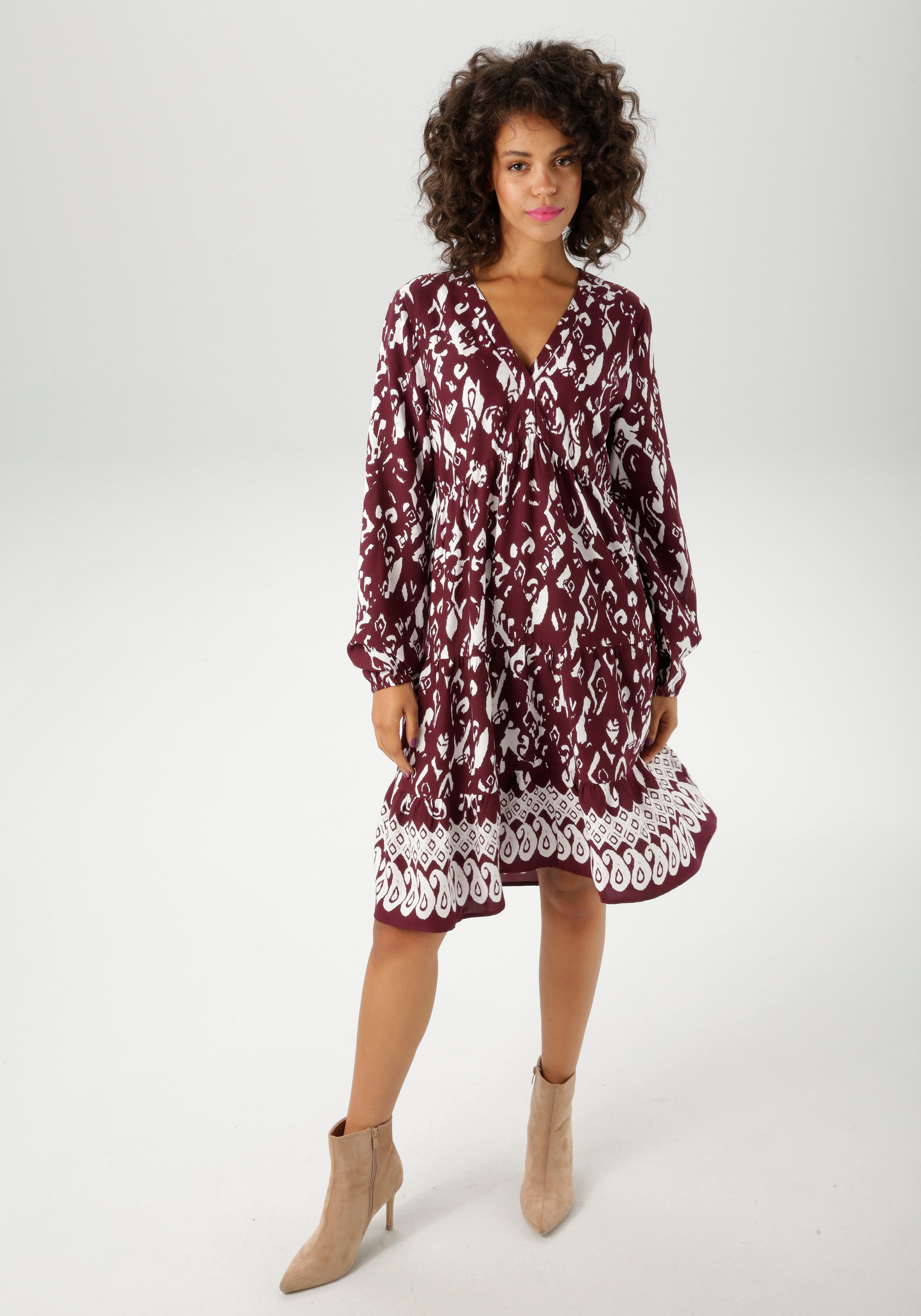 Aniston CASUAL Tunikakleid mit kunstvollem Druck und Bordüre am Saum günstig online kaufen