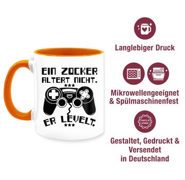 Shirtracer Tasse Ein Zocker altert nicht - er levelt, Keramik, Statement Sprüche