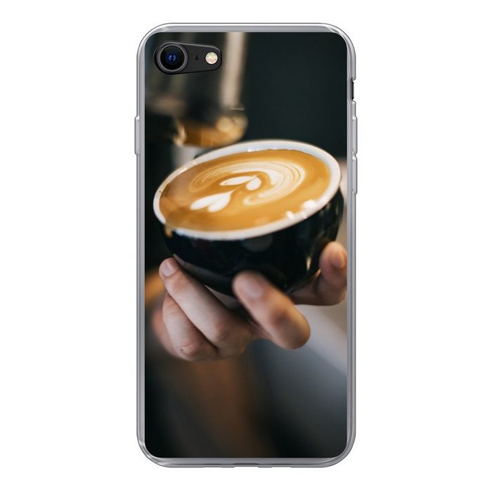 MuchoWow Handyhülle Eine herzförmige Blume in einer Tasse Cappuccino Handyhülle Apple iPhone SE (2020) Smartphone-Bumper Print Handy