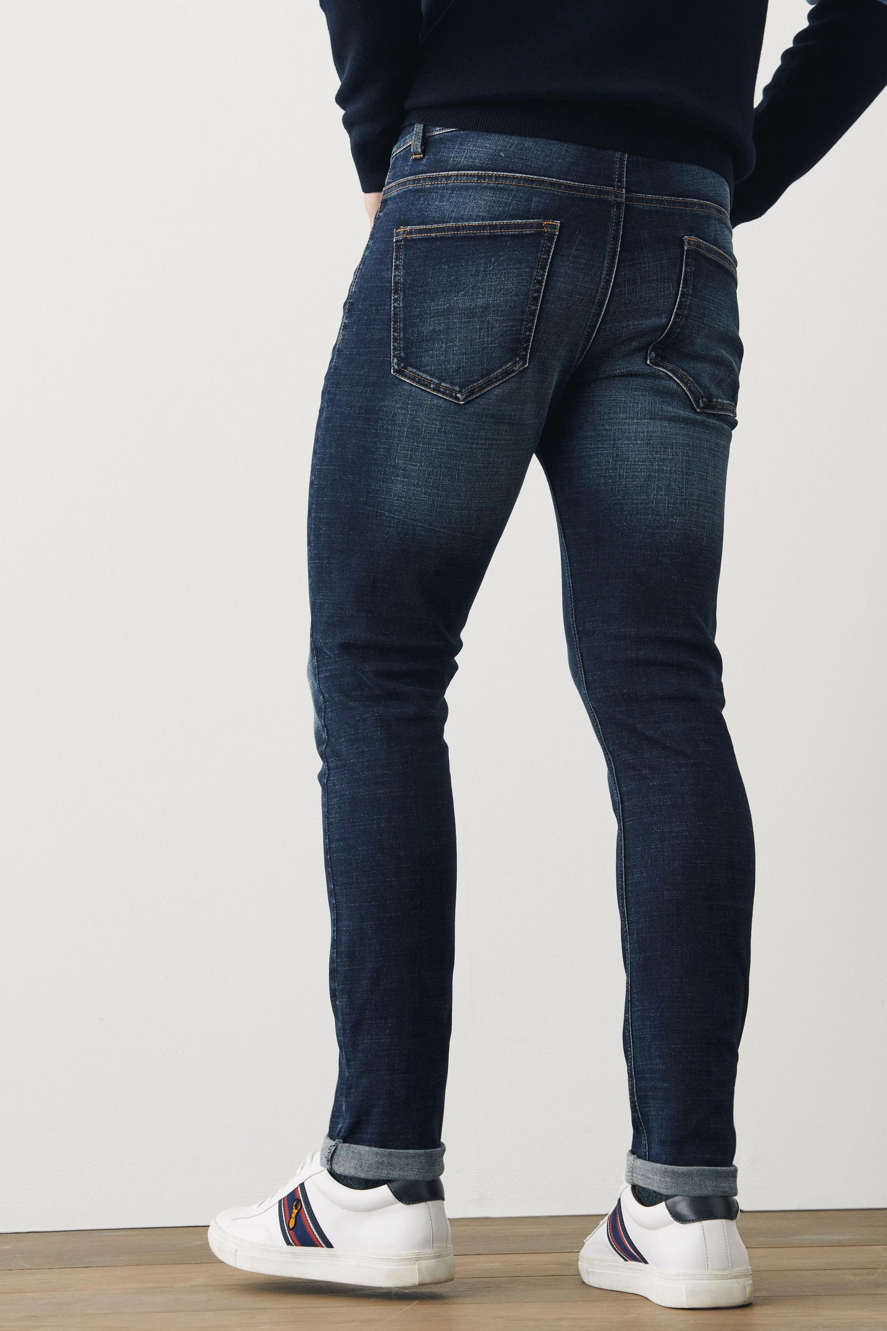 Next Slim-fit-Jeans Motionflex Jeans - Indigo Blue Slim Mid (1-tlg)