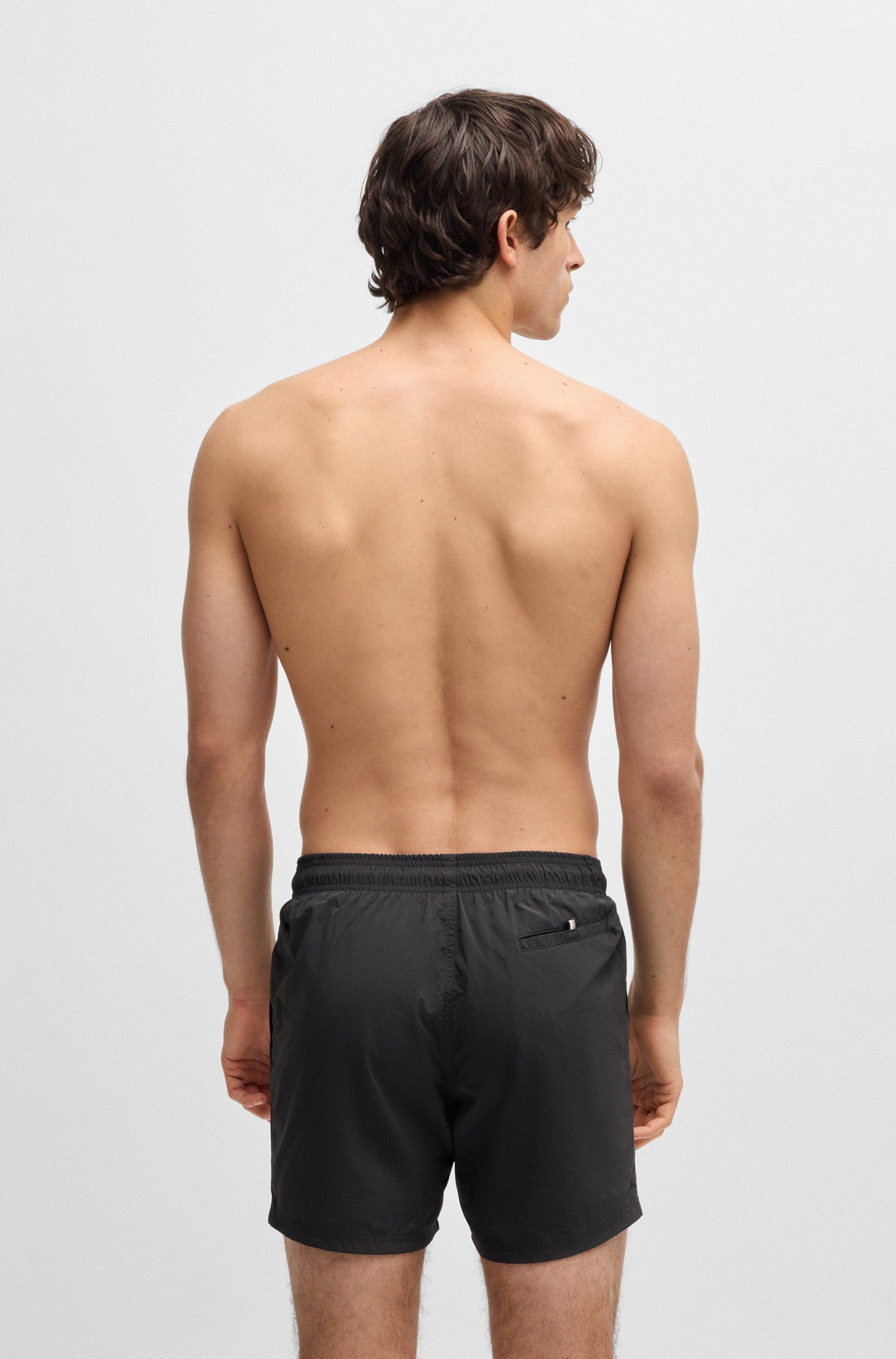 BOSS Badeshorts Octopus Mit BOSS Logoschriftzug, elastischer Taillenbund mit Kordel