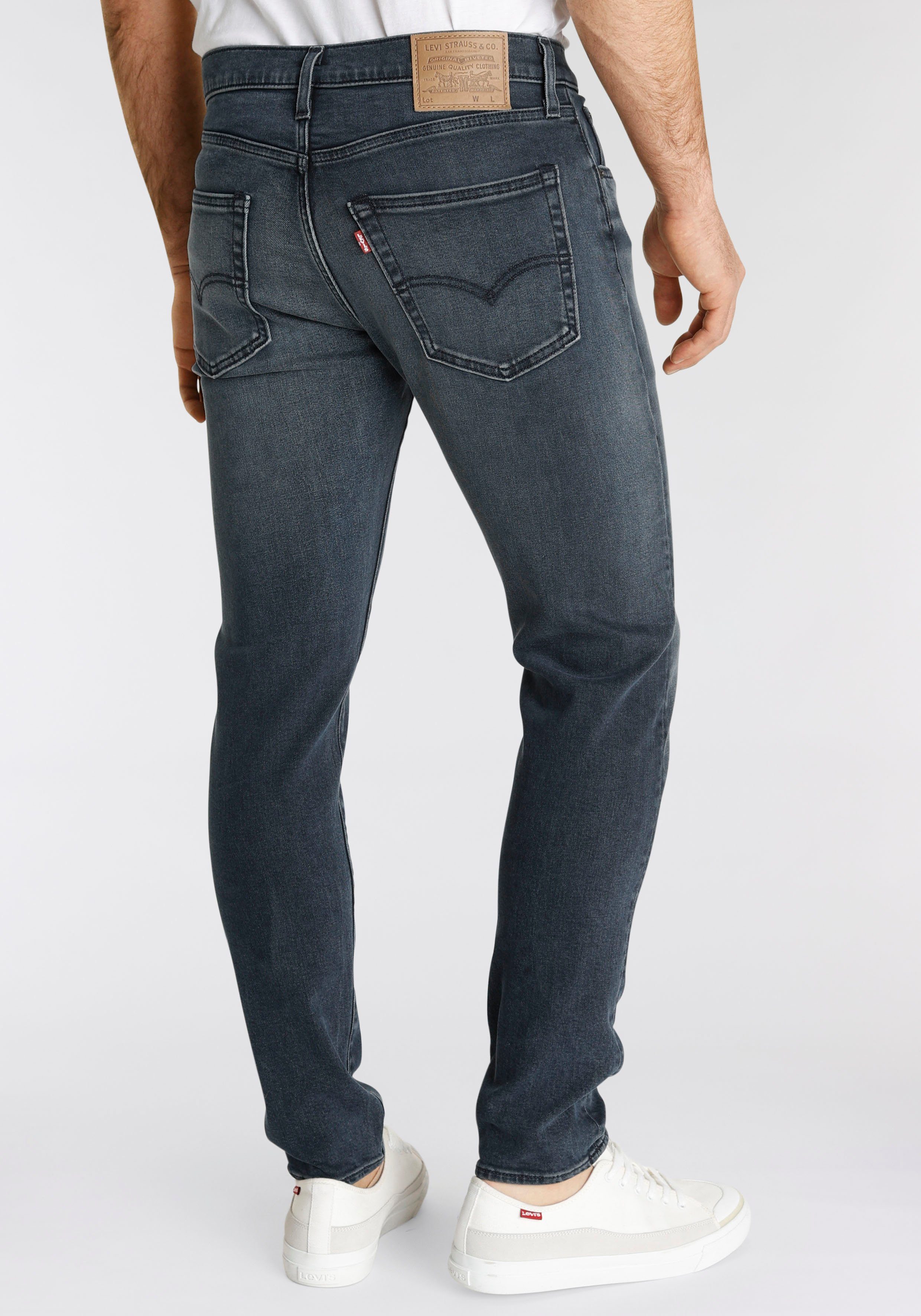 Levi's® Tapered-fit-Jeans 512 mit DARK Slim Taper BLACK STONEWASH Markenlabel Fit