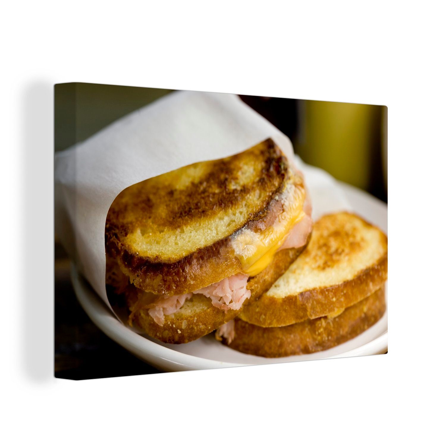 OneMillionCanvasses® Leinwandbild Schinken-Käse-Toast auf einer Serviette, (1 St), Wandbild Leinwandbilder, Aufhängefertig, Wanddeko, 30x20 cm