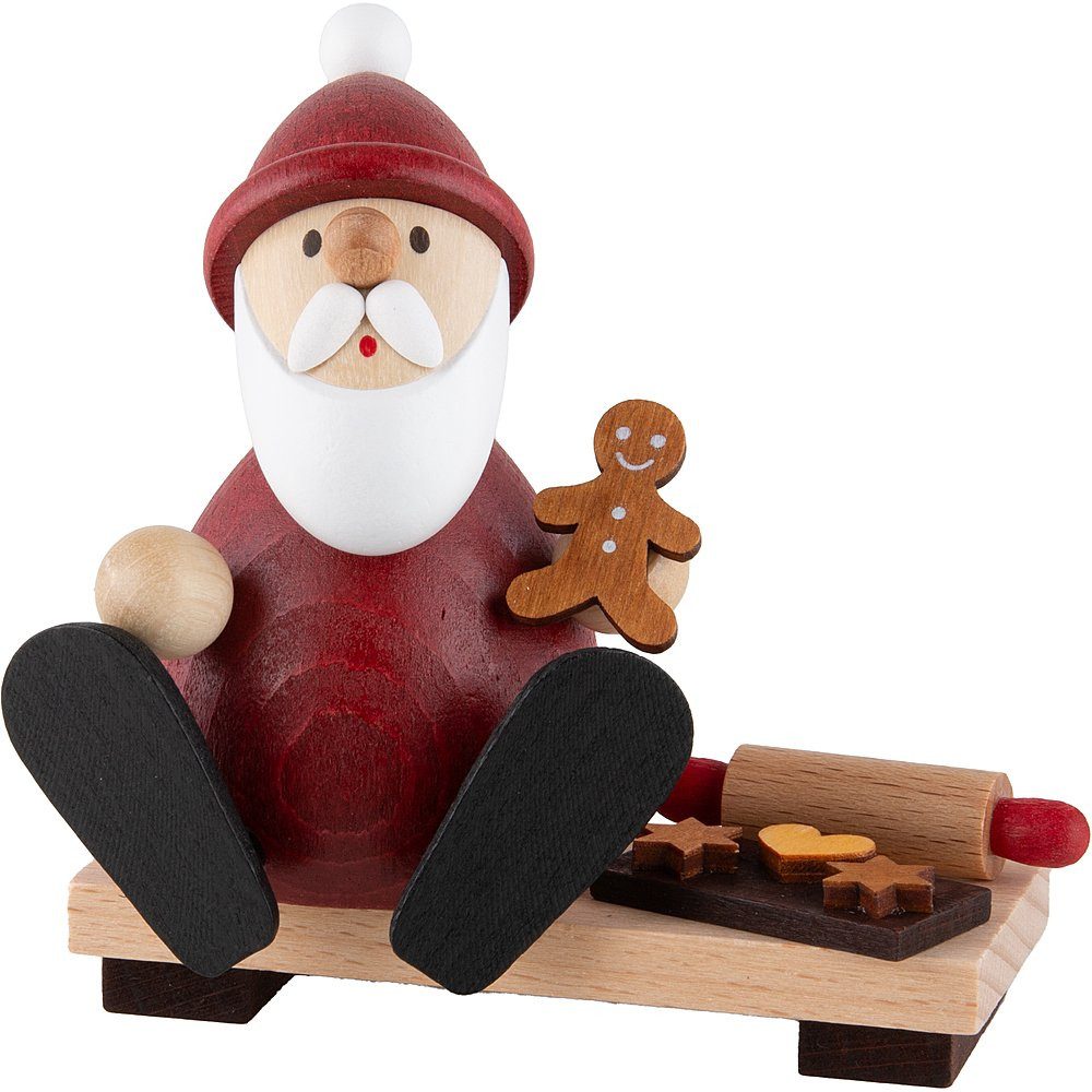 Ullrich Kunsthandwerk Dekofigur Weihnachtsmann auf Bank mit Lebkuchenmann, Backblech und Nudelholz (9c