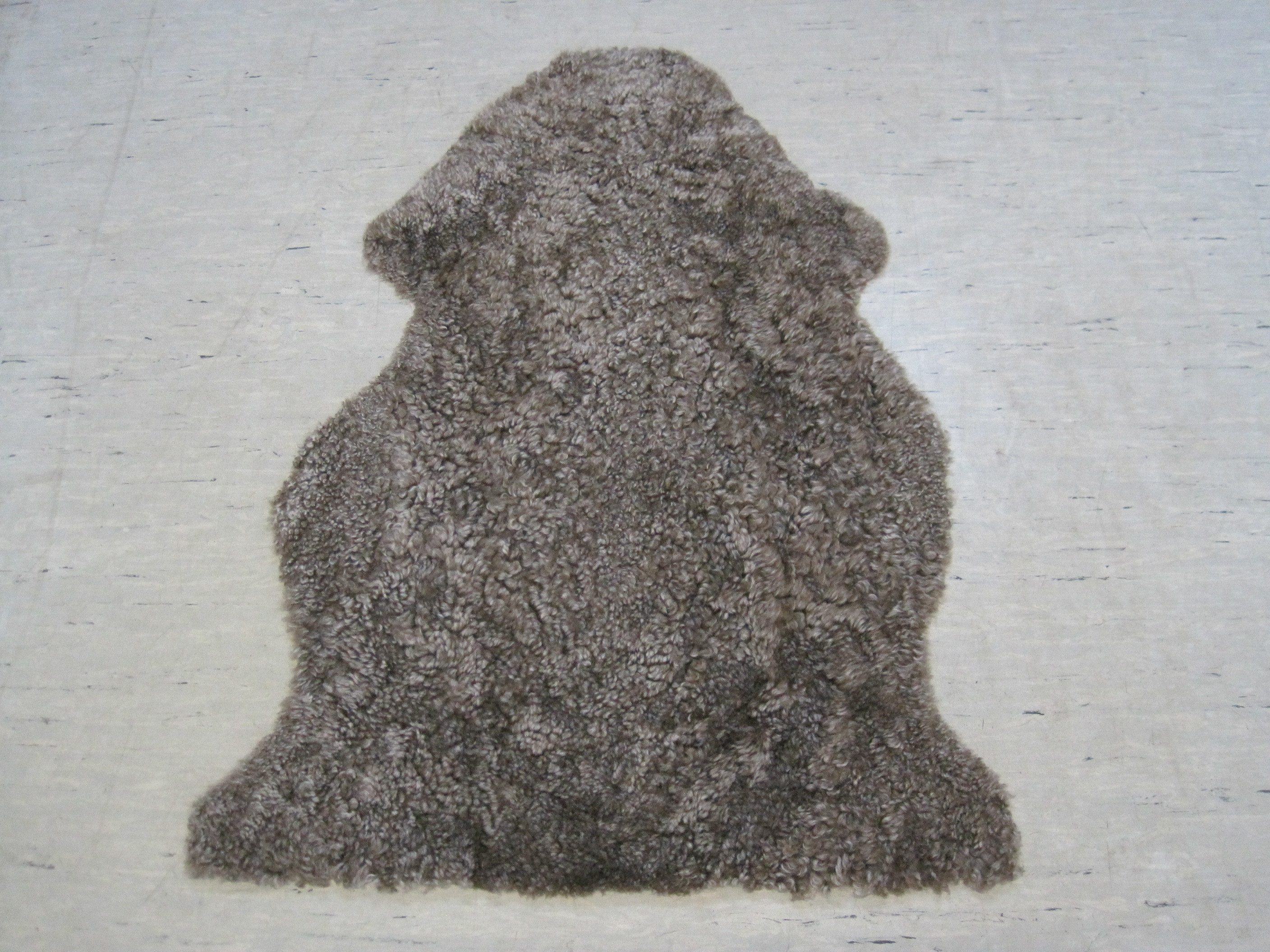 Heitmann Felle Fellteppich Lammfell Curly, fellförmig, Höhe: 25 mm, echtes Lammfell mit natürlicher Lockung, geschoren, weich & kuschelig