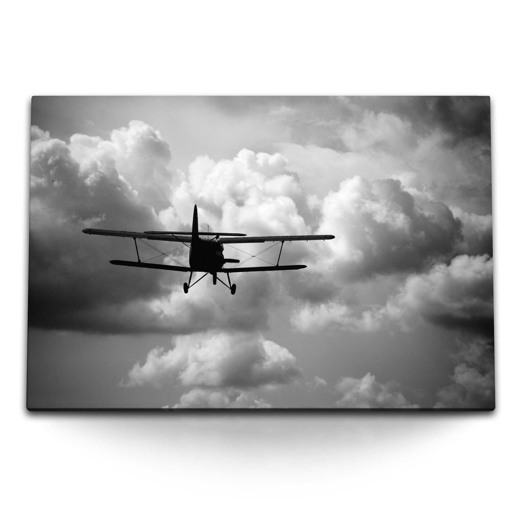 Leinwandbild 120x80cm Wandbild auf Leinwand Propellerflugzeug Flugzeug über den Wol