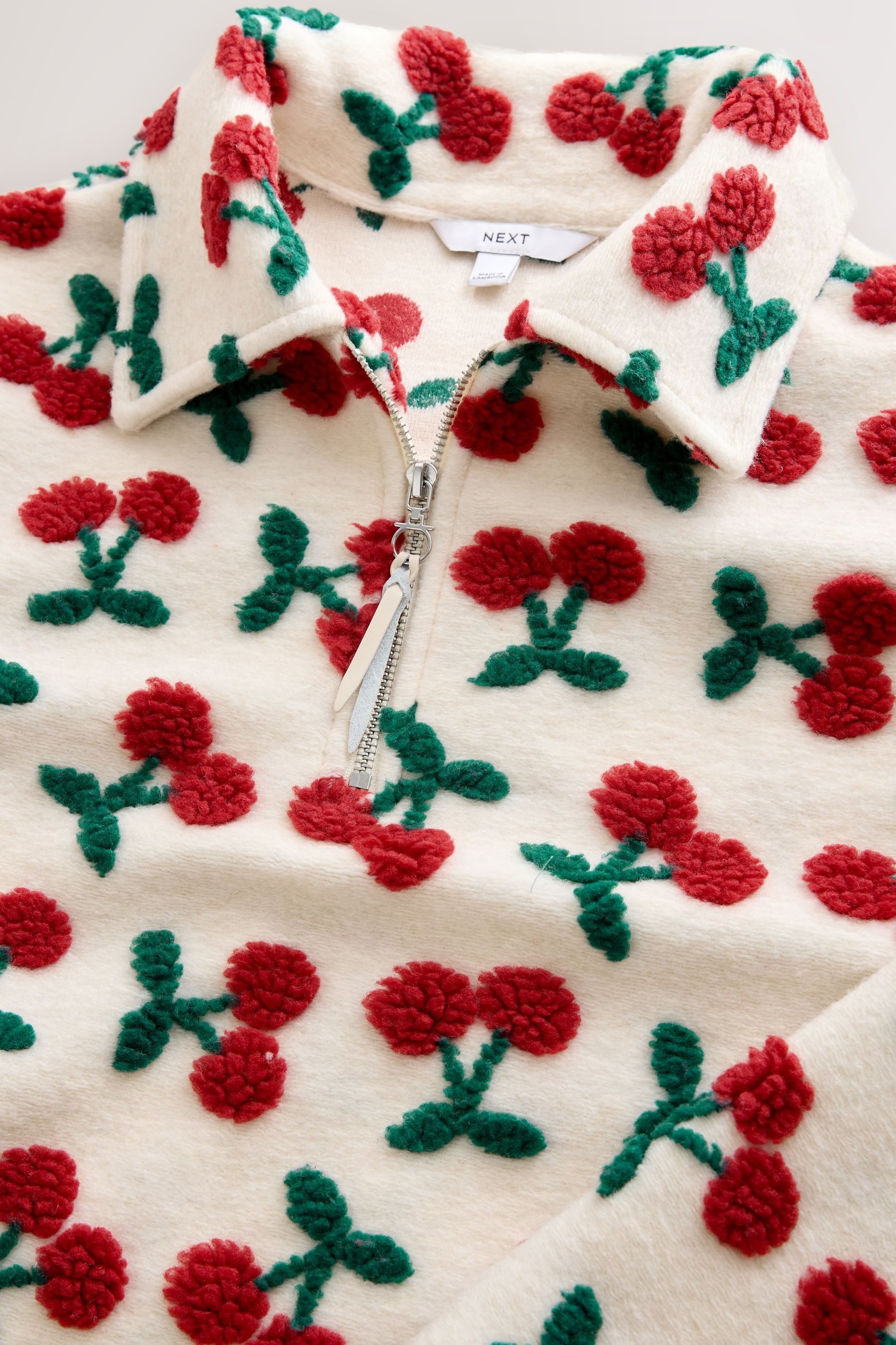 Next Fleecepullover Borg-Fleece mit RV-Kragen und Grafik (1-tlg)