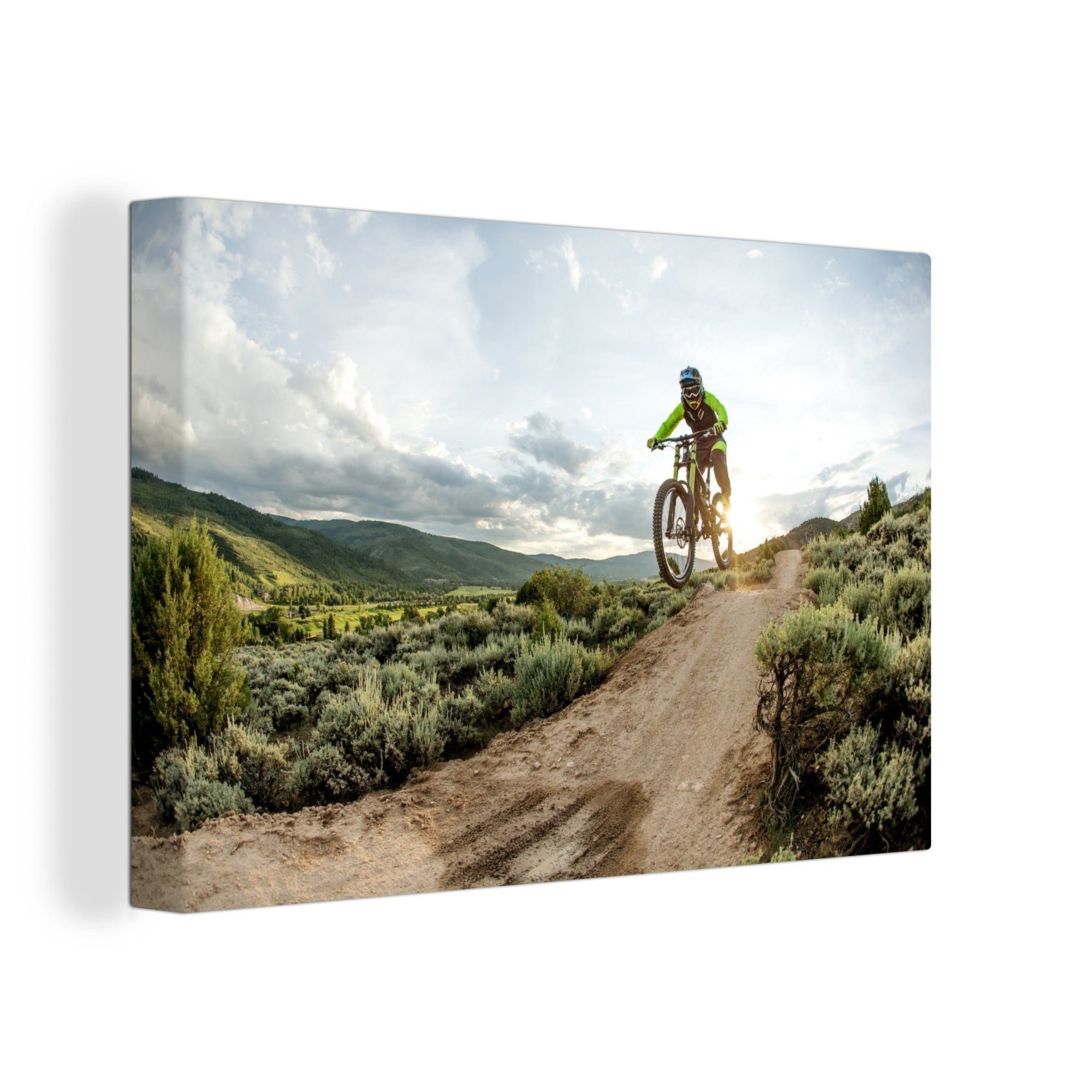 30x20 Wandbild springt OneMillionCanvasses® ein St), auf Mountainbike, (1 Wanddeko, Leinwandbild Aufhängefertig, cm Frau Leinwandbilder,
