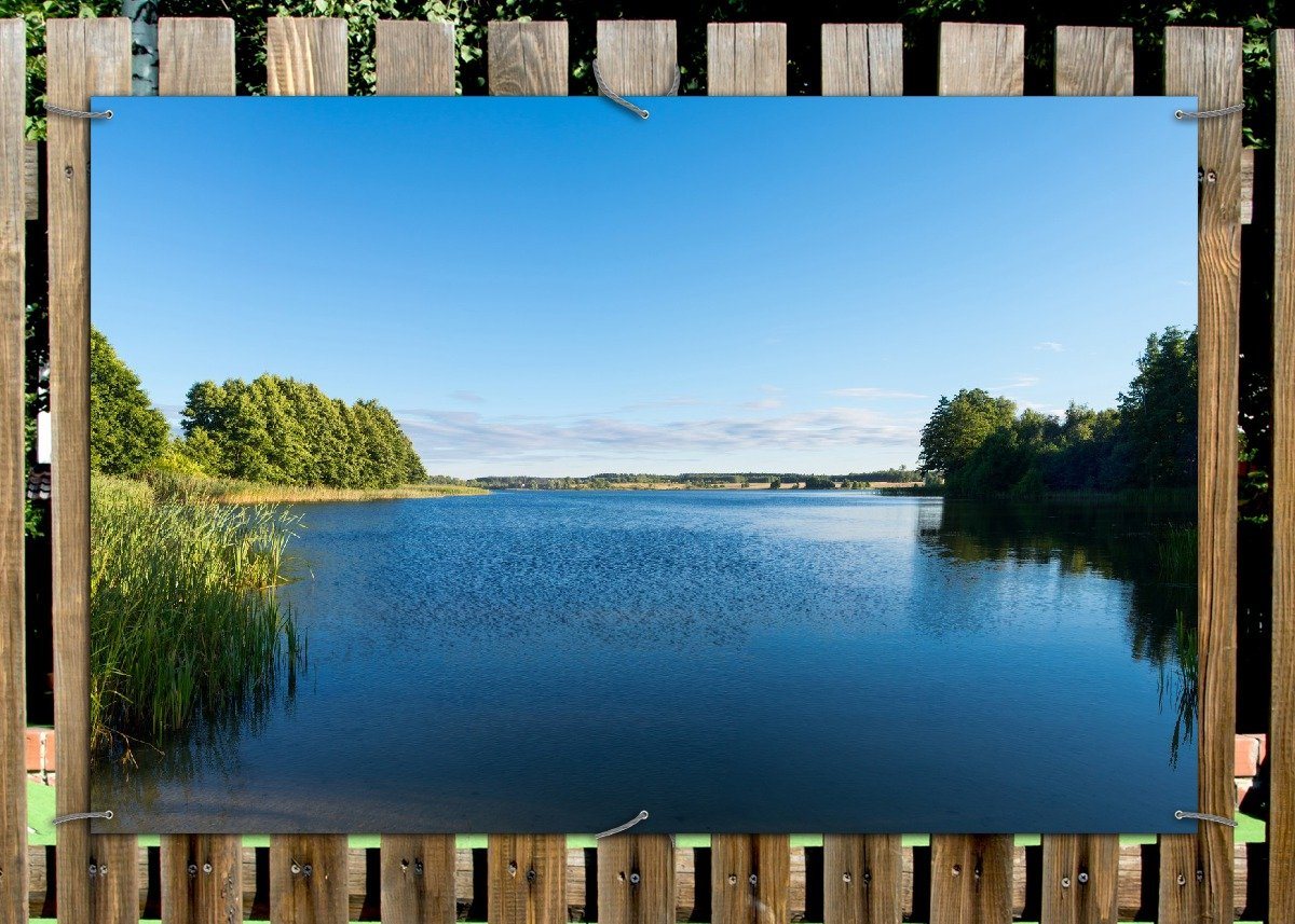 Thumbnail - Wallario Sichtschutzzaunmatten Malerischer See mit Schilf unter blauem Himmel