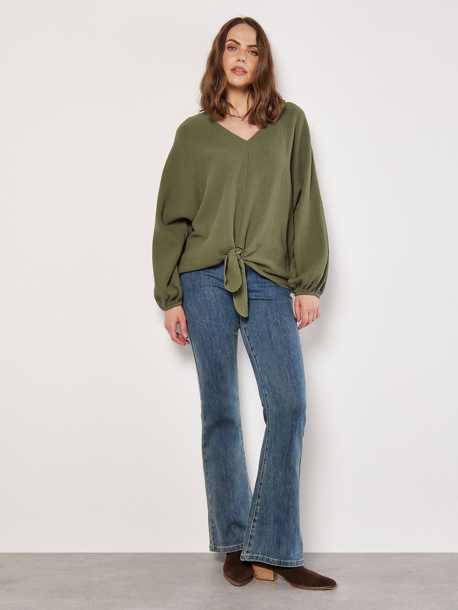 Apricot Strickpullover überschnitten, mit Knoten günstig online kaufen