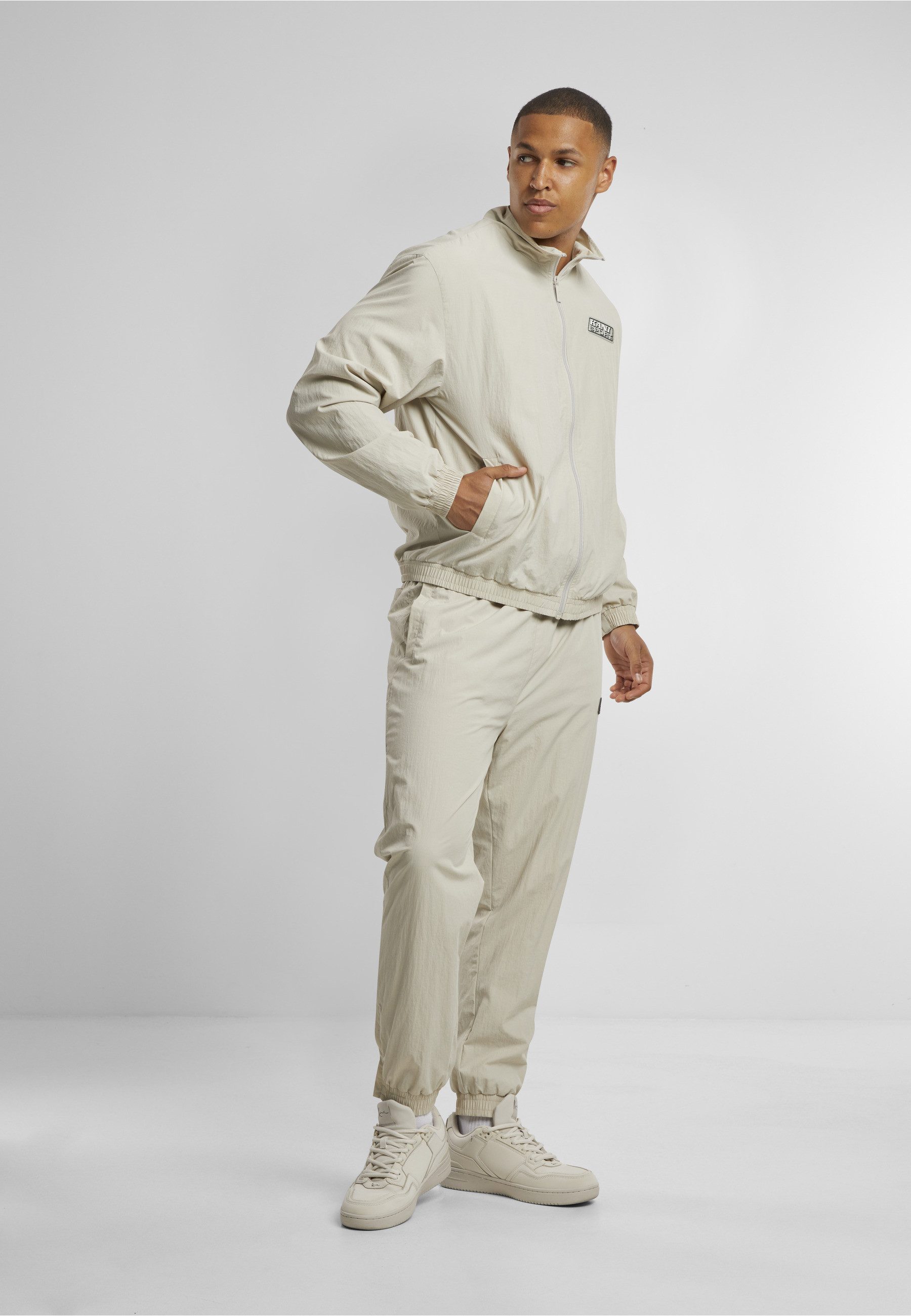 Karl Kani Trainingsjacke Karl Kani Sport Patch Essential Trackjacket (1-St)