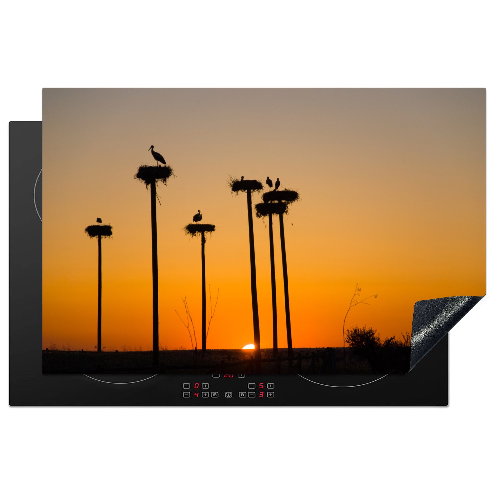 MuchoWow Herdblende-/Abdeckplatte Silhouetten von Störchen und Nestern vor einem Sonnenuntergang, Vinyl, (1 tlg), 81x52 cm, Induktionskochfeld Schutz für die küche, Ceranfeldabdeckung