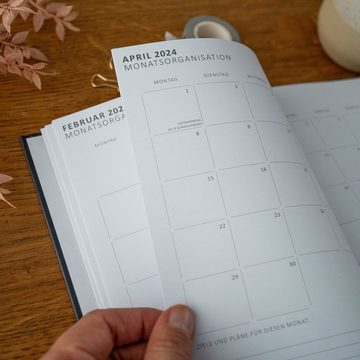 Eine der Guten Verlag Terminkalender Terminplaner 2024 - A5, schwarz, 1 Doppelseite / Woche, 168 S. FSC-Papier, Softcover, klimaneutral