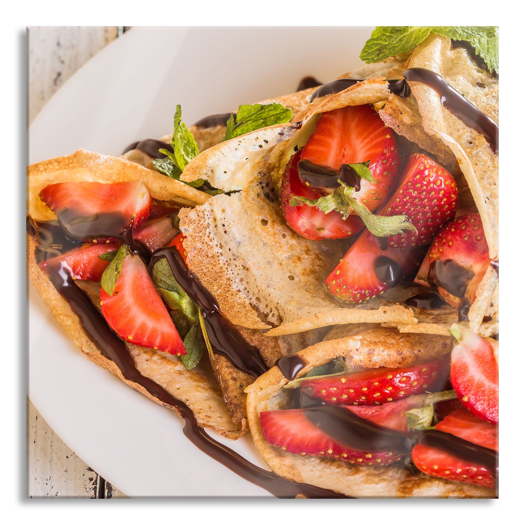 Glasbild Crêpes mit Erdbeeren