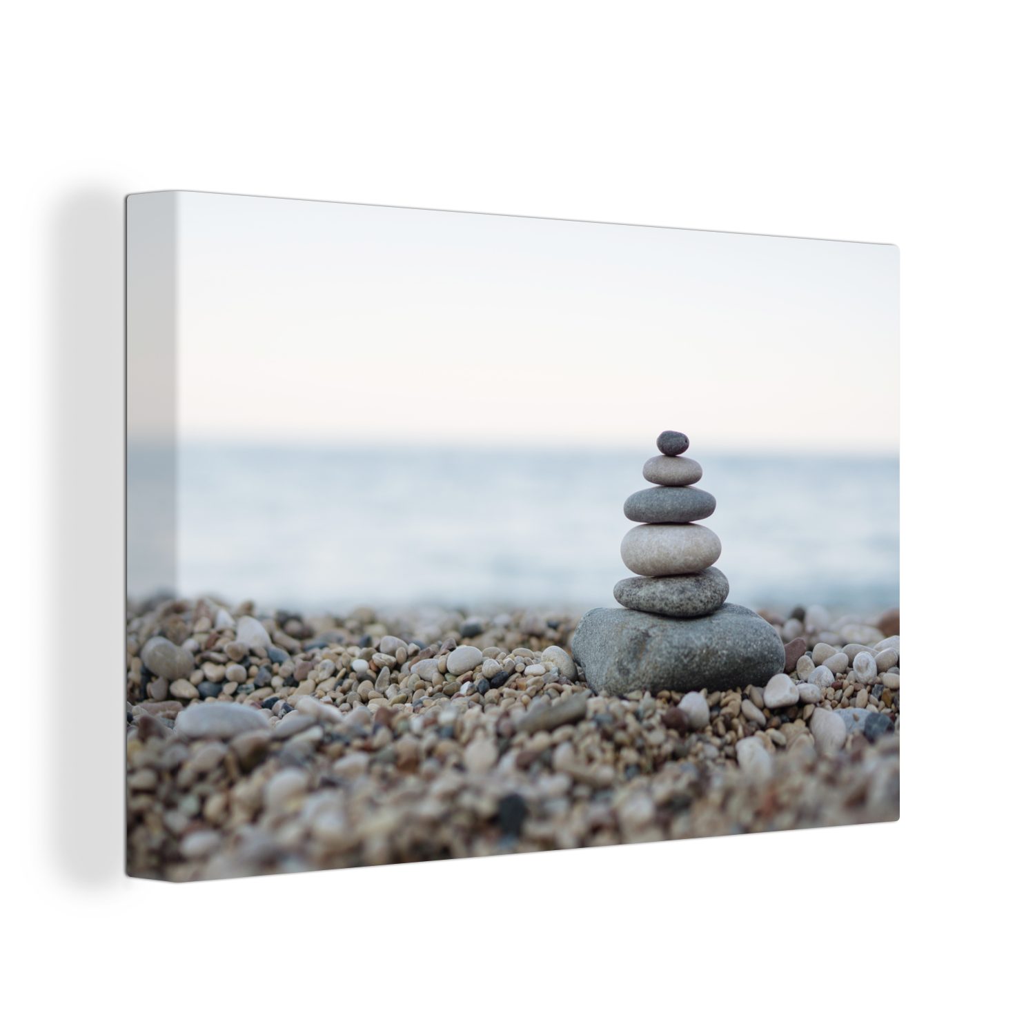 Leinwandbild Balancierende Steine am Kieselstrand