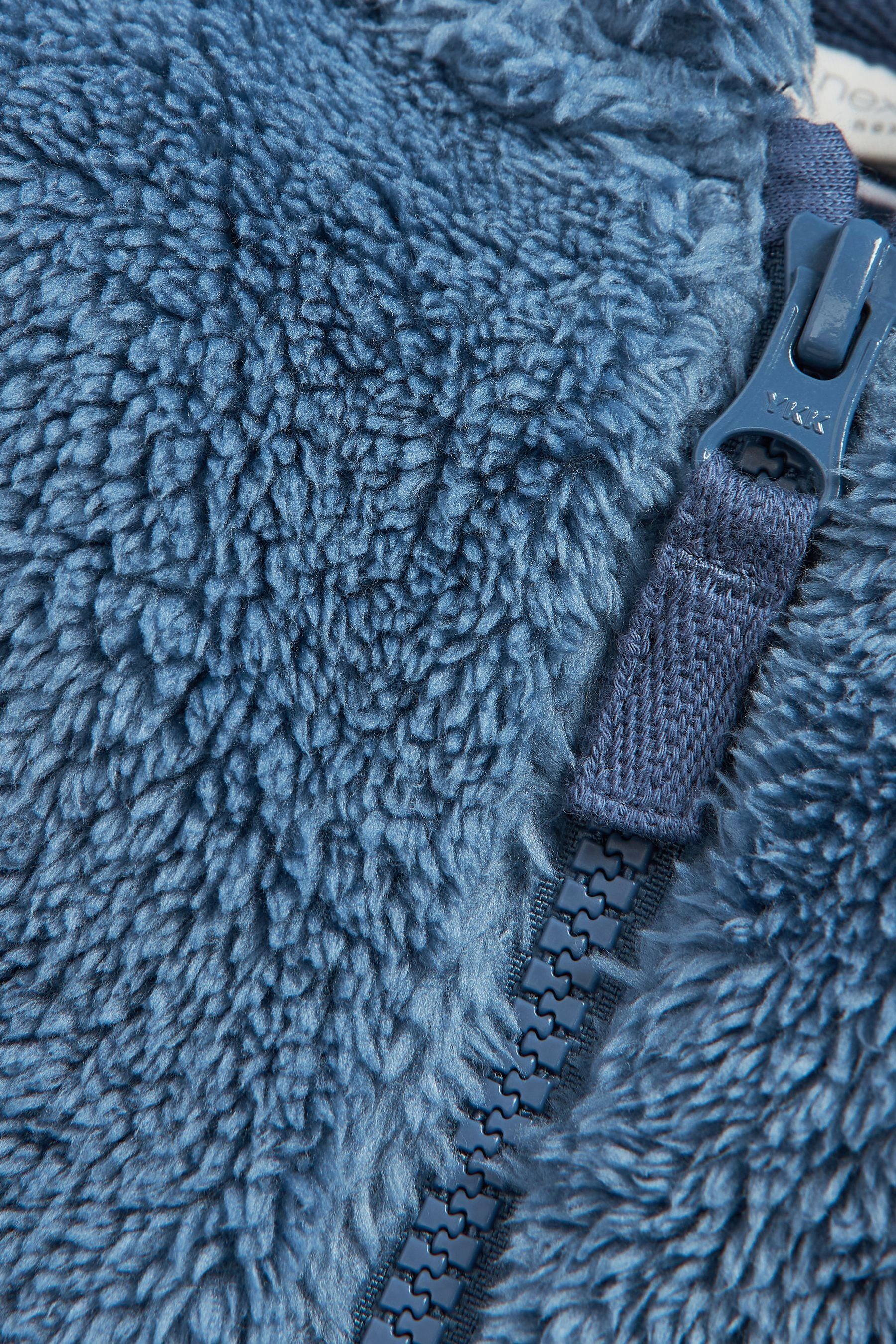 mit (1-St) Kuschelige aus Fleece Next Blue Jacke Bärenmotiv Kapuzenfleecejacke