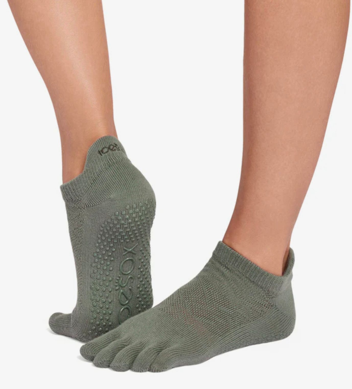 ToeSox Sportsocken Toesox Full Toe LOWRISE Logo auf der Ferse und in der Gummierung der Sohle
