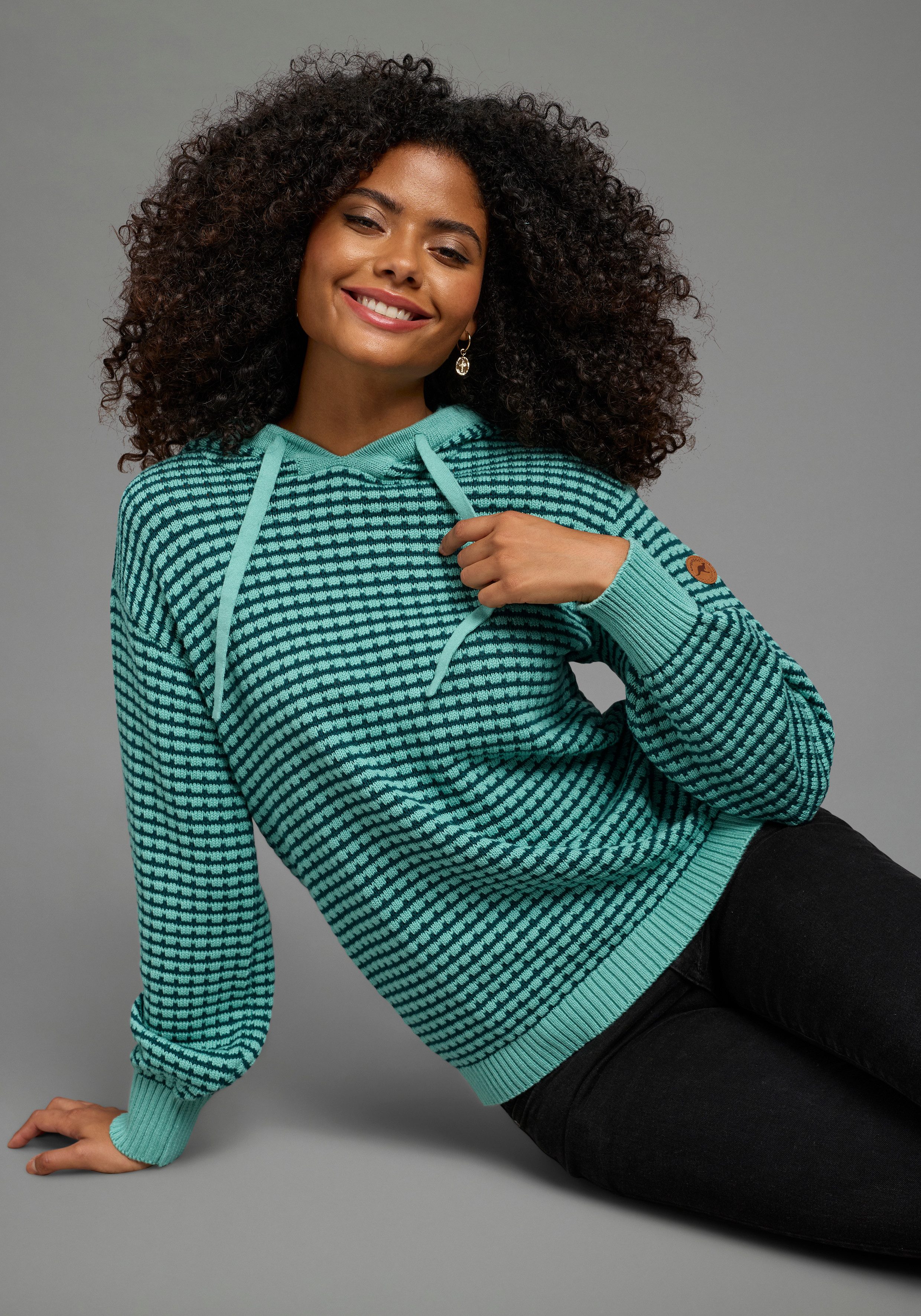 KangaROOS Strickpullover mit Kapuze und Kordelzug, Oversize-Passform, hüftlange Schnittform. € 49,99, (€ 49,99 pro 1 Stk).
