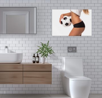 Wallario Wandfolie, Fußball - sexy Frau mit einem Fußball, wasserresistent, geeignet für Bad und Dusche