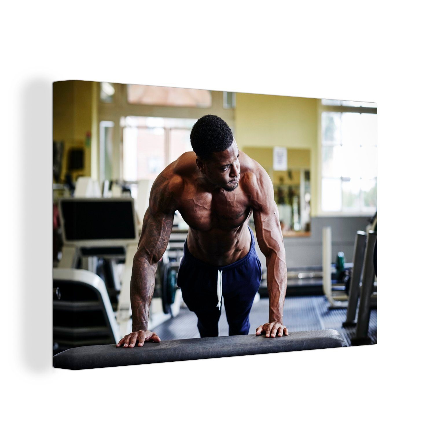 OneMillionCanvasses® Leinwandbild Ein Bodybuilder beim Training im Fitnessstudio, (1 St), Wandbild Leinwandbilder, Aufhängefertig, Wanddeko, 30x20 cm