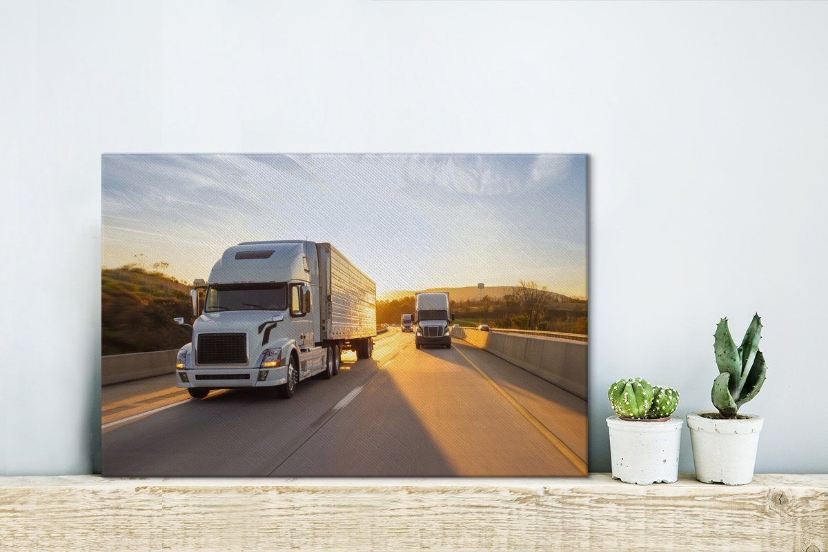Leinwandbild (1 St), Wandbild OneMillionCanvasses® Leinwandbilder, cm Wanddeko, Sonnenuntergang, mit Lastwagen Aufhängefertig, Zwei 30x20
