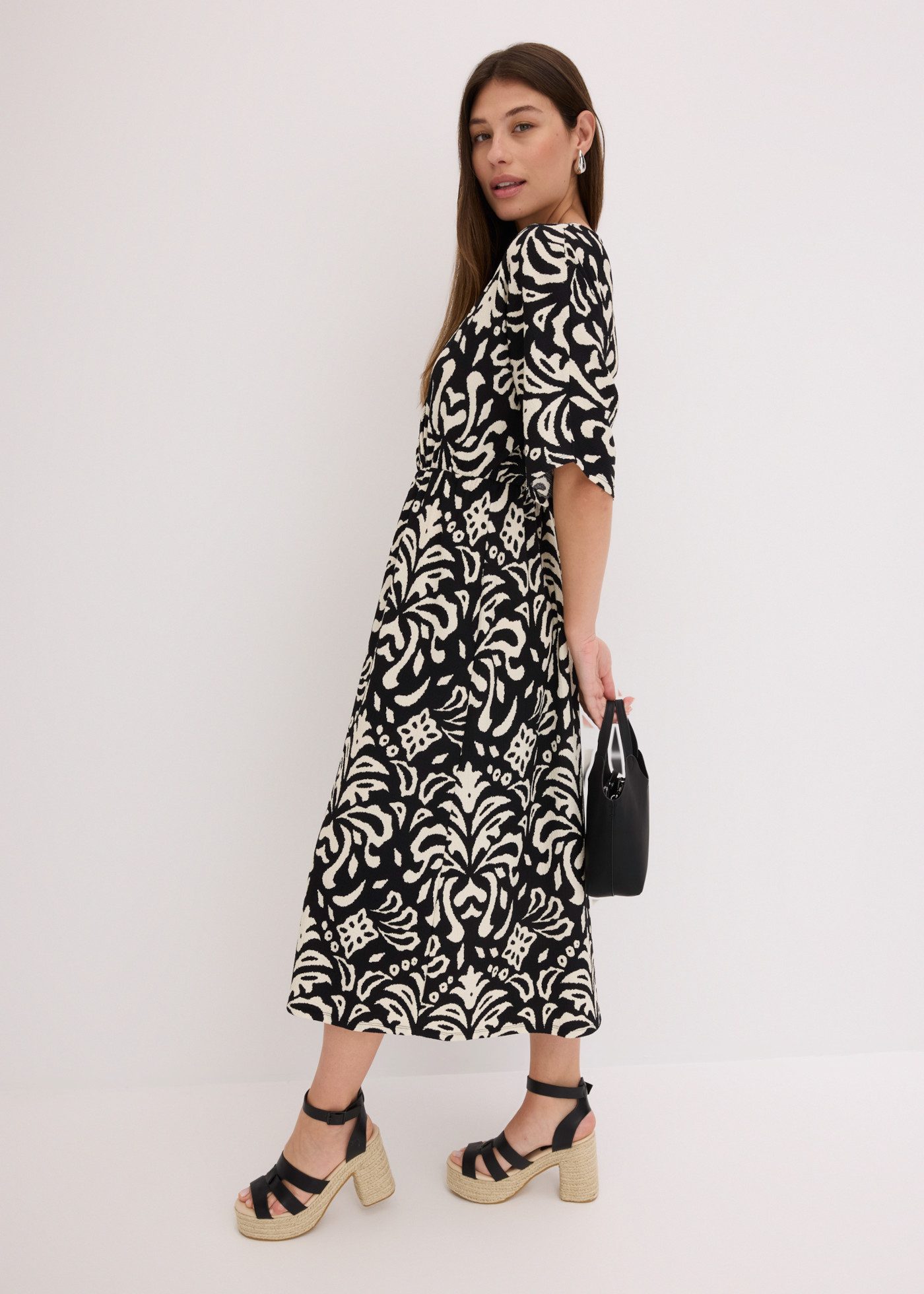 bonprix Jerseykleid eleganter Stil, tiefer V-Ausschnitt, mit modischem Druck