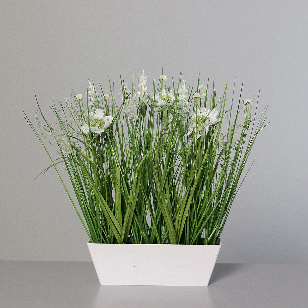 Kunstpflanze künstliches Wiesenblumengras in weißer rechteckiger Kunststoffschale, mucPlants