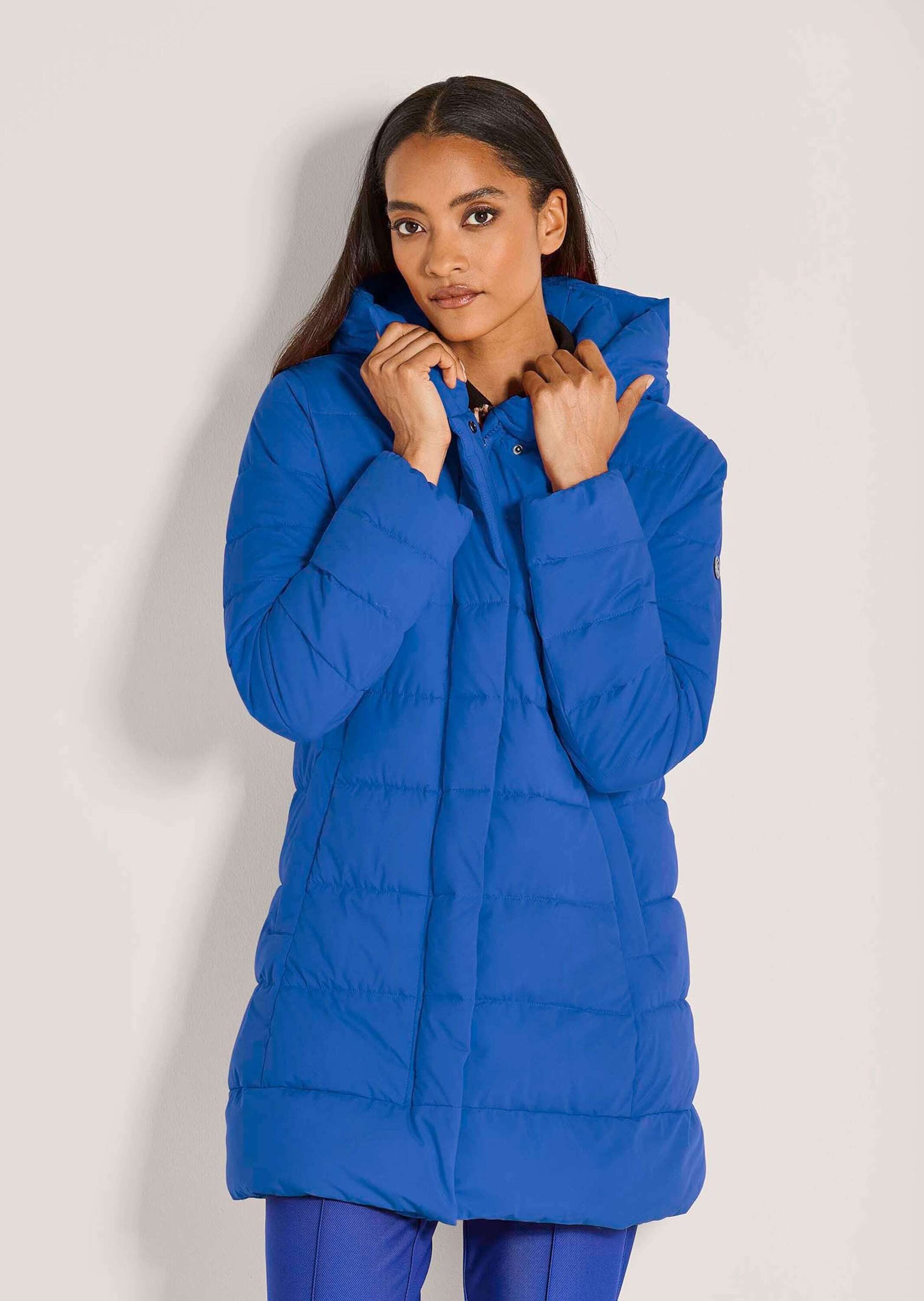 MADELEINE Steppjacke Lange Steppjacke mit Kapuze Quergesteppter Wintermante günstig online kaufen