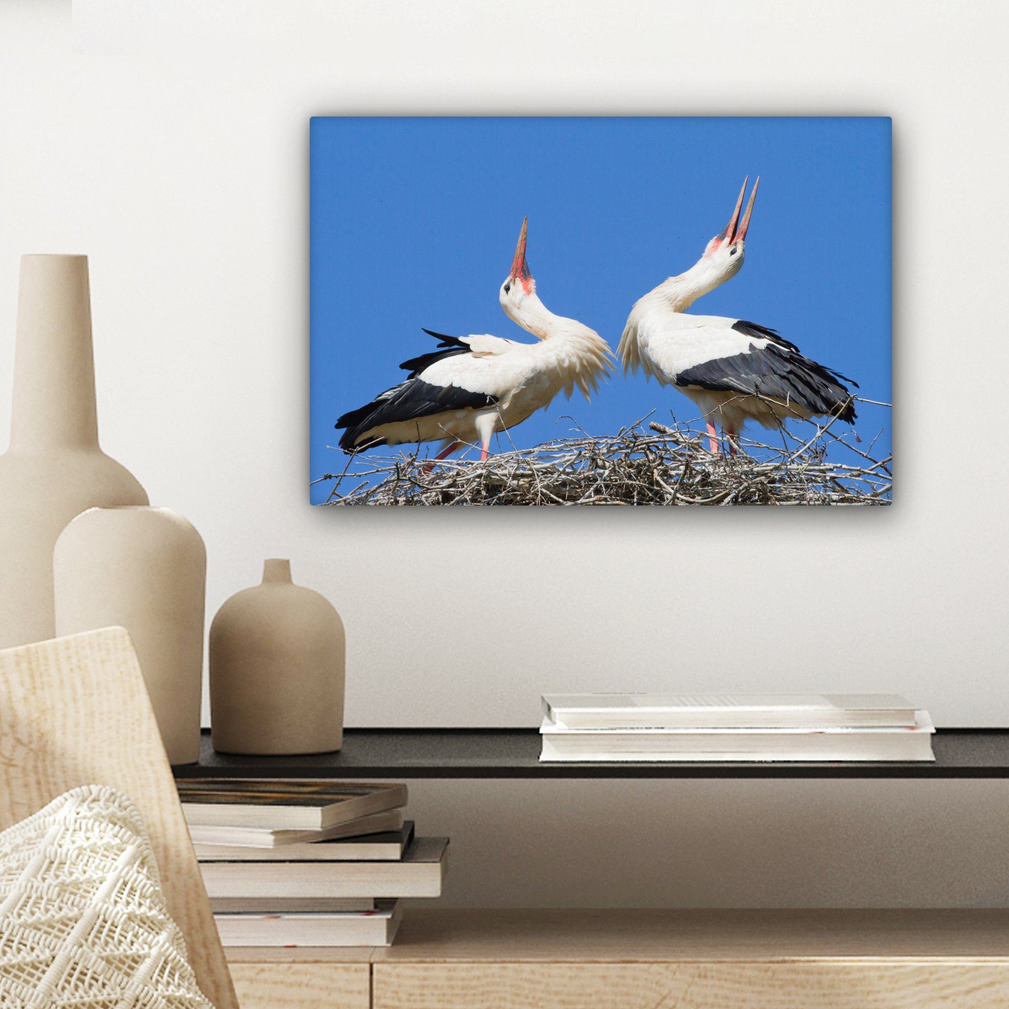 OneMillionCanvasses® Leinwandbild Atemberaubendes Bild von Störchen Wandbild 30x20 Wanddeko, in Leinwandbilder, cm St), Nest, ihrem zwei (1 Aufhängefertig