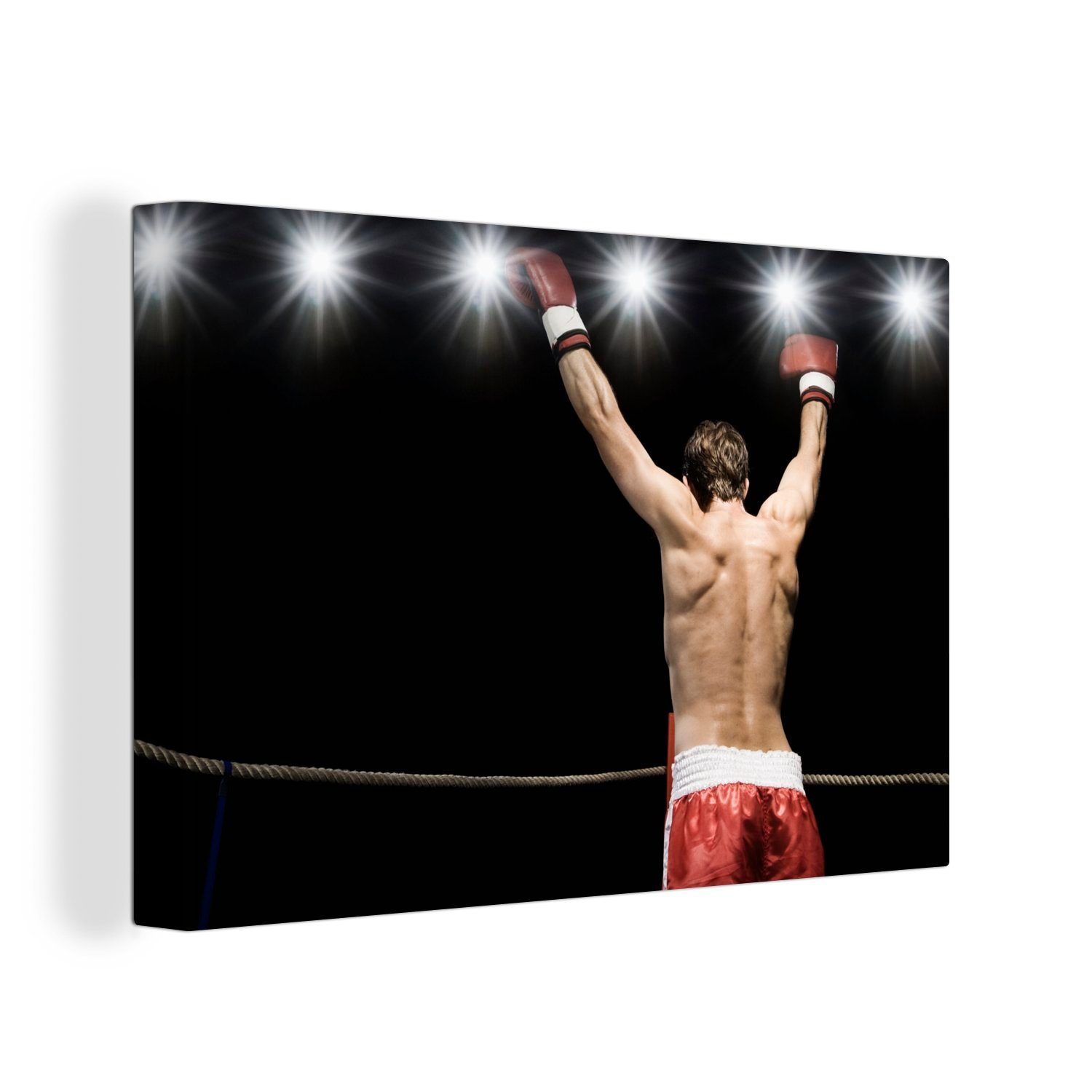 OneMillionCanvasses® Leinwandbild Ein Boxer hebt nach einem Sieg die Arme in die Luft, (1 St), Wandbild Leinwandbilder, Aufhängefertig, Wanddeko, 30x20 cm