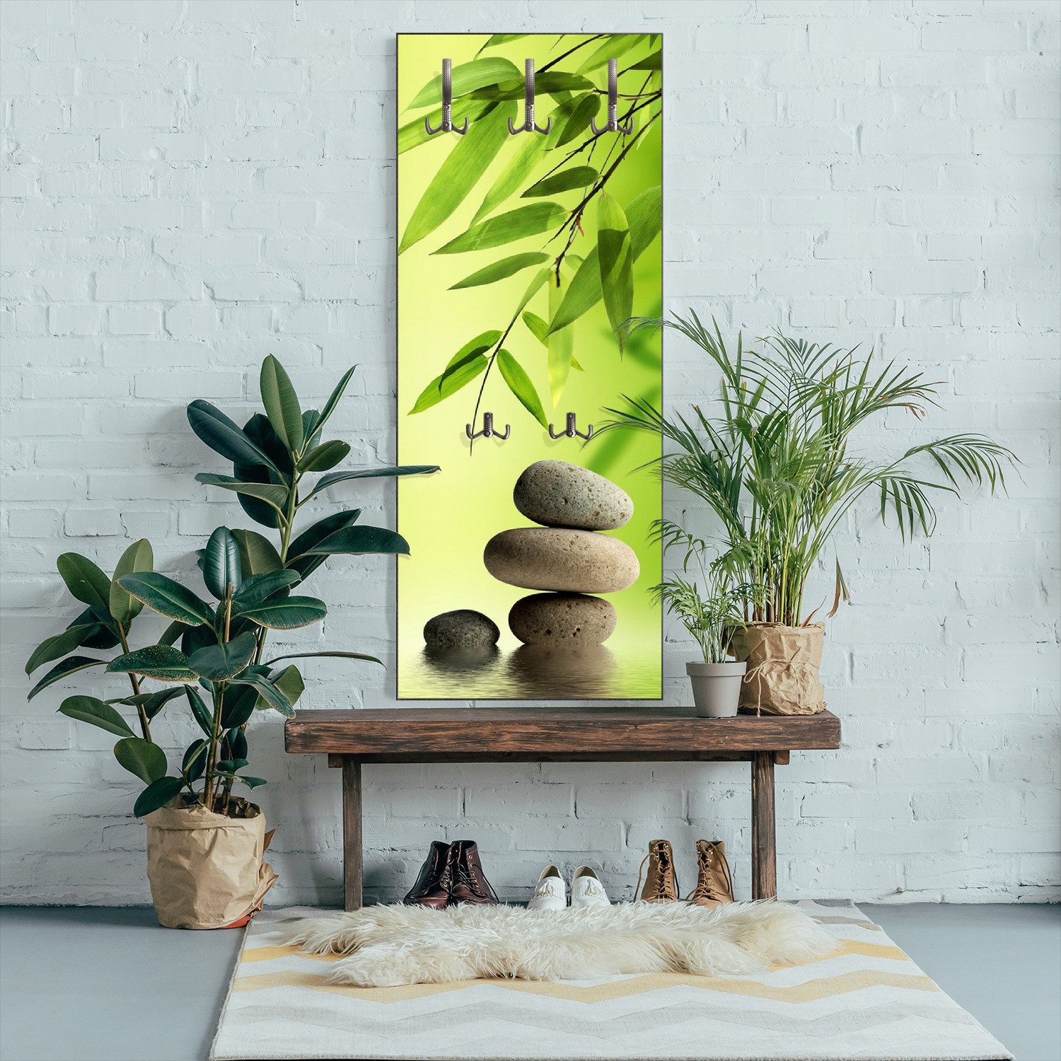 Wallario Garderobenpaneel Steinstapel im Grünen (1-teilig, inkl. Haken und Befestigung), 50x125cmHolz