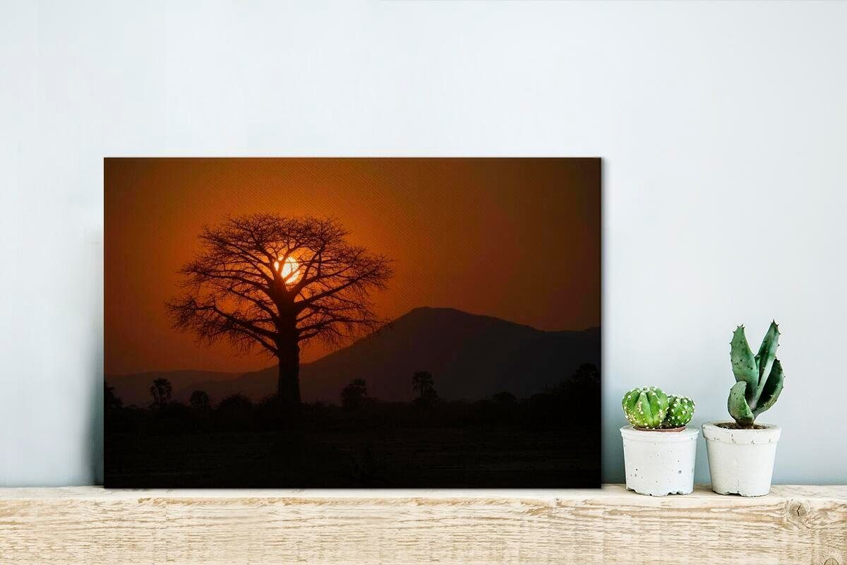 im OneMillionCanvasses® Wandbild einem Zambezi, cm Lower Wanddeko, 30x20 Leinwandbilder, Aufhängefertig, hinter Oranger Leinwandbild (1 St), Baobab-Baum Sonnenuntergang