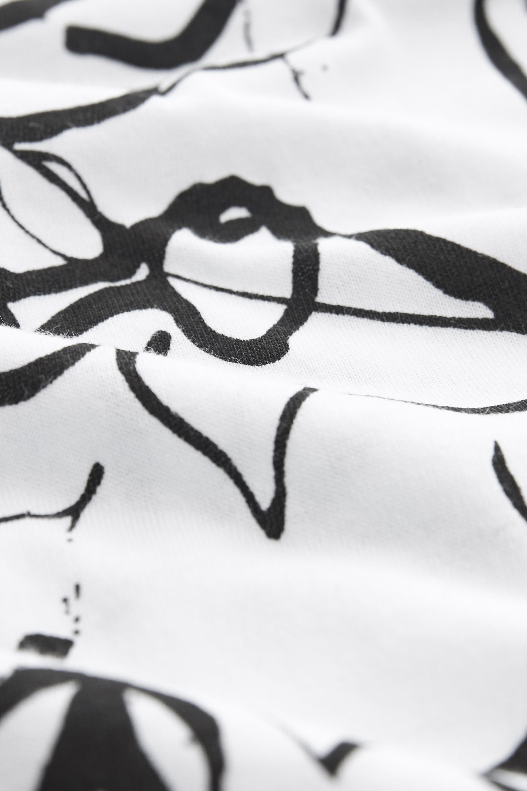 (1-tlg) T-Shirt Black/White Rundhalsausschnitt mit Swirl T-Shirt Next Kurzärmliges