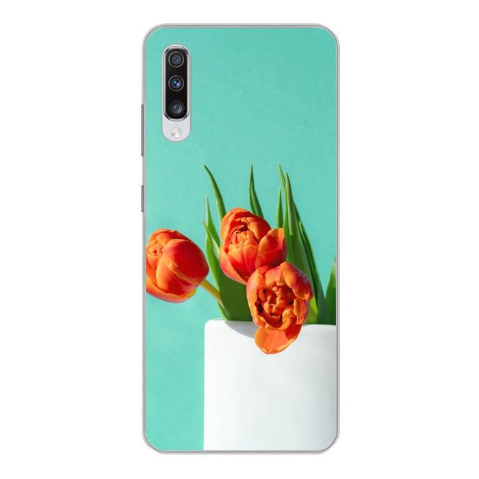 MuchoWow Handyhülle Orangefarbene Tulpen in einer weißen Vase vor grünem Hintergrund Phone Case Handyhülle Samsung Galaxy A70 Silikon Schutzhülle