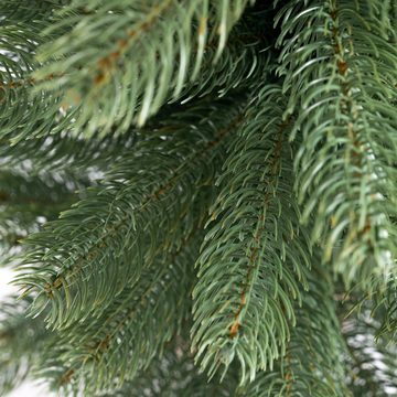 IC Winterworld Künstlicher Weihnachtsbaum Tannenbaum, künstlicher Christbaum, Nordmanntanne, Weihnachtsdeko mit Jutebeutel um den Betonfuß