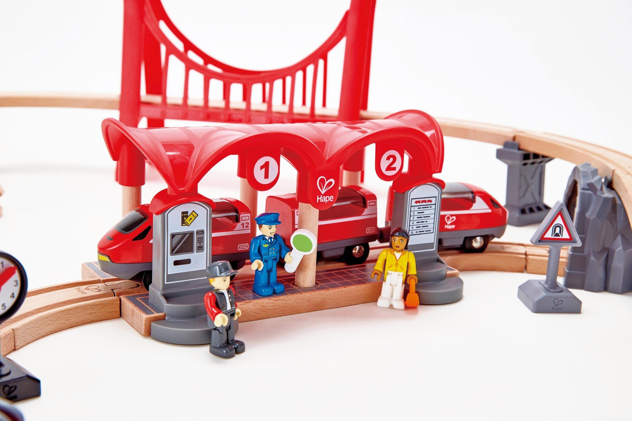 Hape Spielzeugeisenbahn-Gebäude Eisenbahn-Set - Verkehrsreiche Stadt