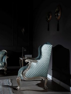 Casa Padrino Sessel Luxus Barock Ohrensessel Hellblau / Silber / Gold 77 x 80 x H. 113 cm - Wohnzimmer Sessel mit elegantem Muster und dekorativem Kissen - Barock Wohnzimmer Möbel