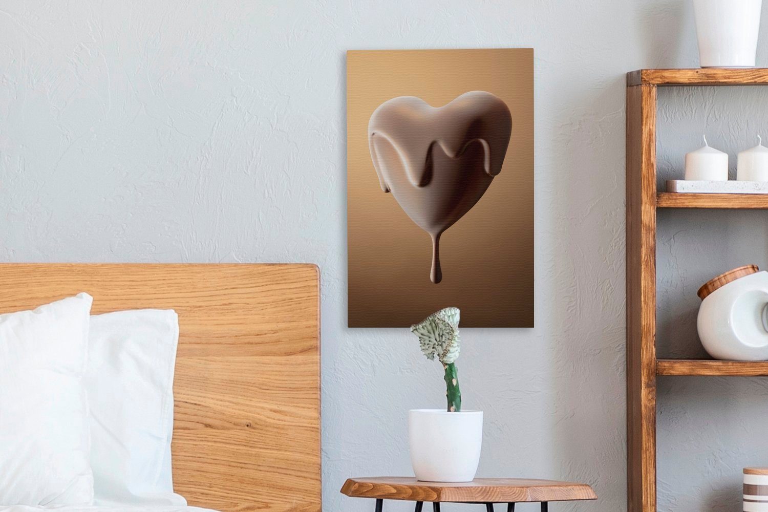 OneMillionCanvasses® Leinwandbild Ein 20x30 bespannt Gemälde, überzogenes herzförmiges, Bonbon, (1 Zackenaufhänger, inkl. fertig cm mit Schokolade St), Leinwandbild